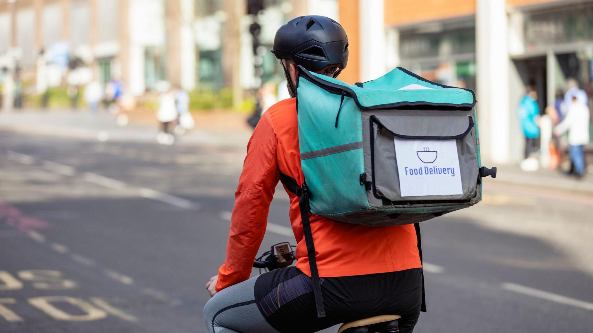 Food delivery driver on bike