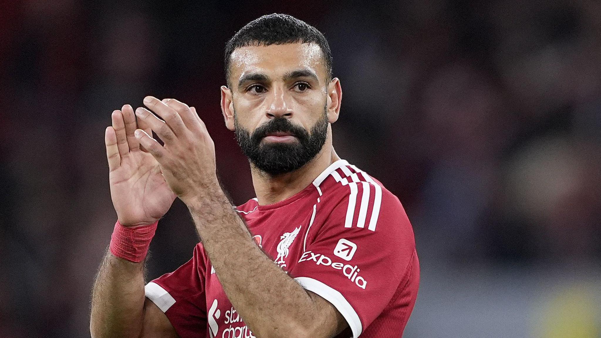 Mohamed Salah applauding while playing for Liverpool