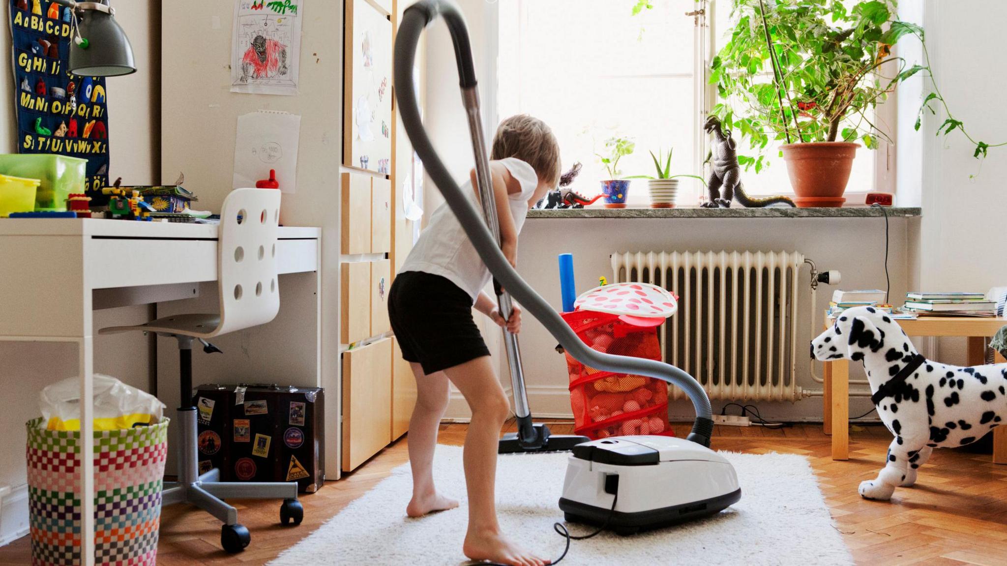 A boy hovers a kids bedroom