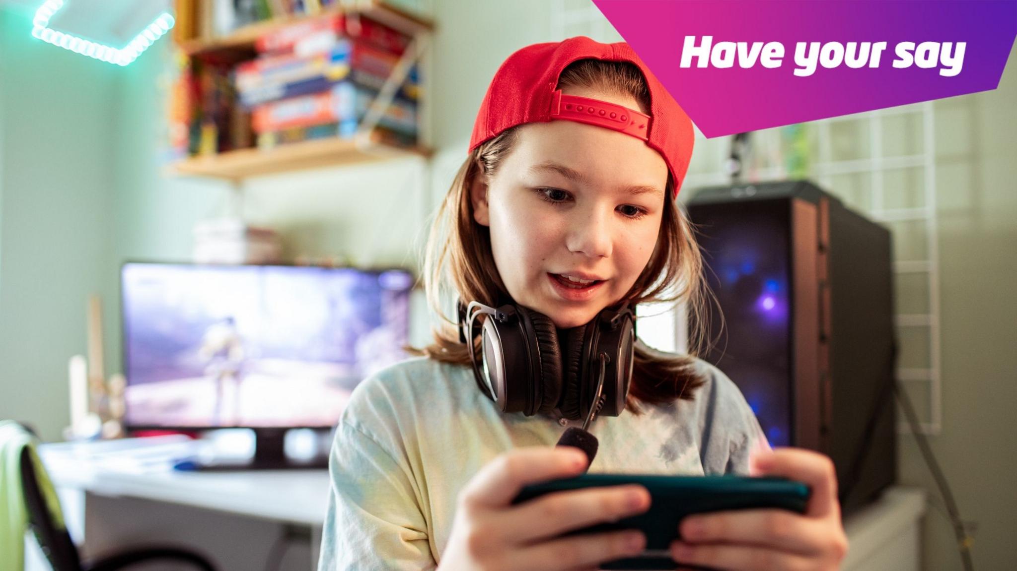 girl on phone with gaming PC in background