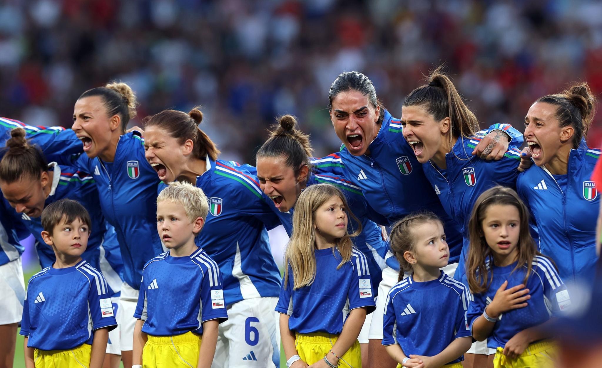 Players of Italy sing their sides national anthem prior to their match against Spain. Photo by Eddie Keogh