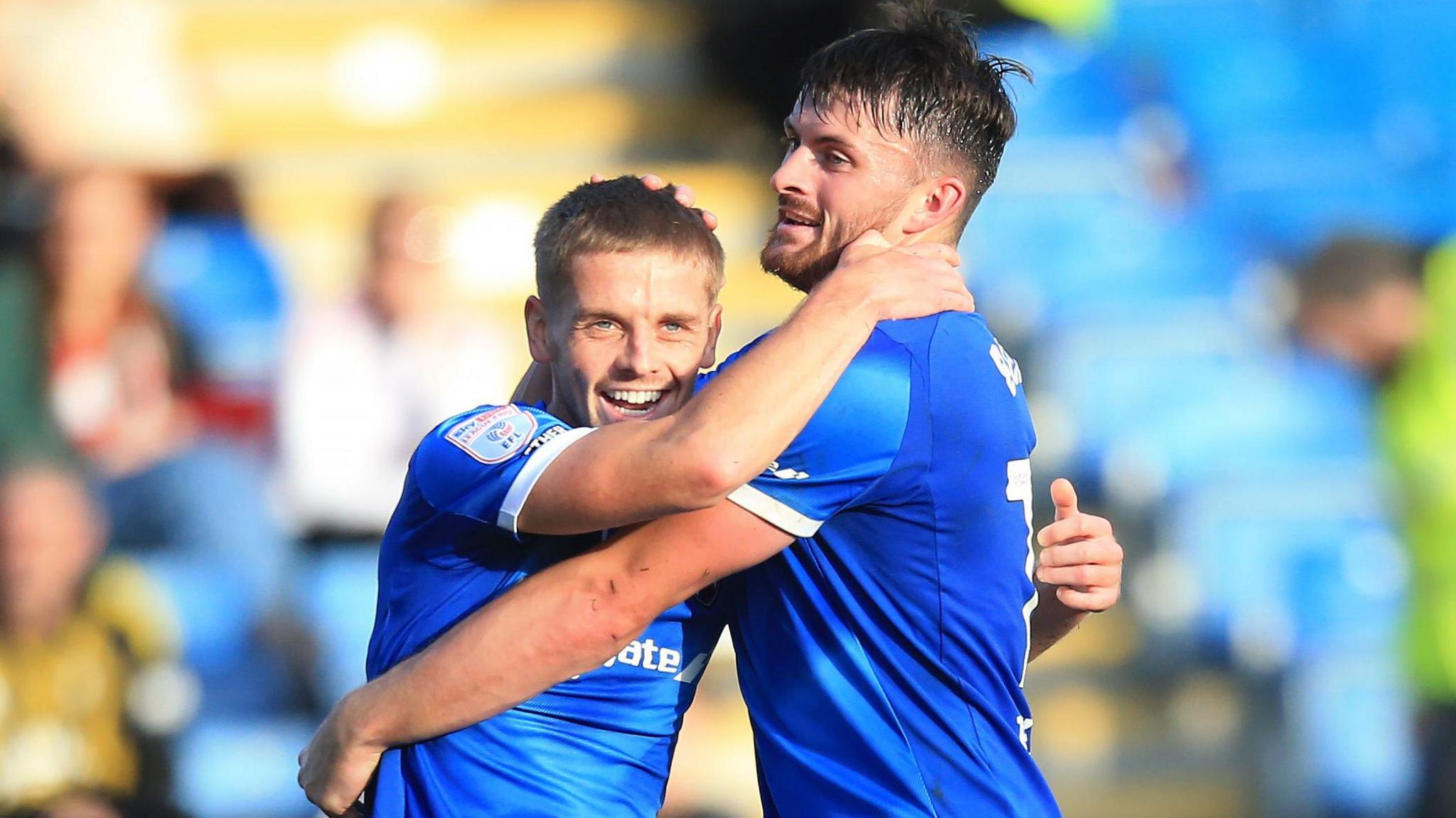 Ronan Darcy of Chesterfield (on the left) celebrates scoring their second goal against Salford City