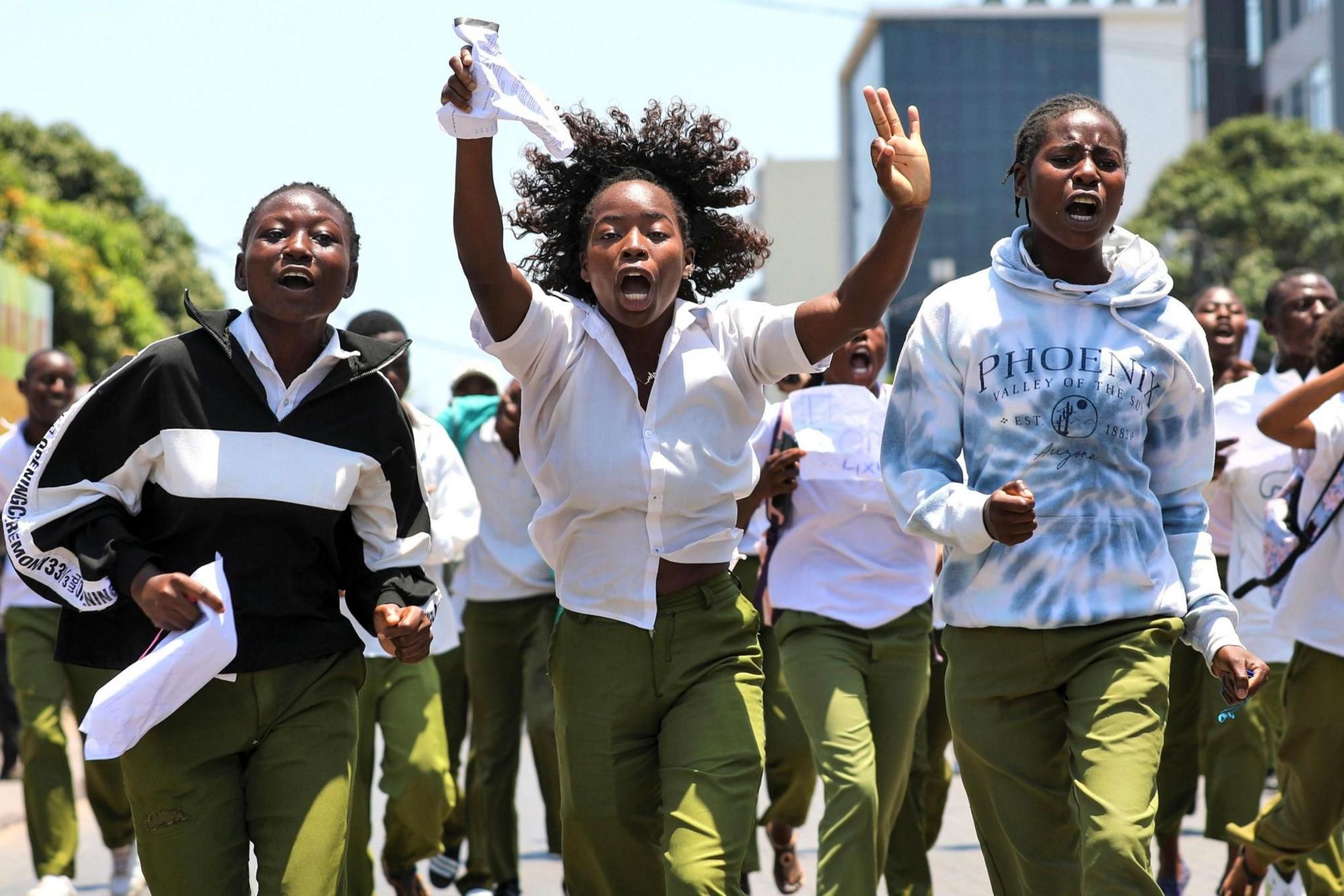 Students march against the October election results as they return home from their final secondary school exams, in Maputo, Mozambique