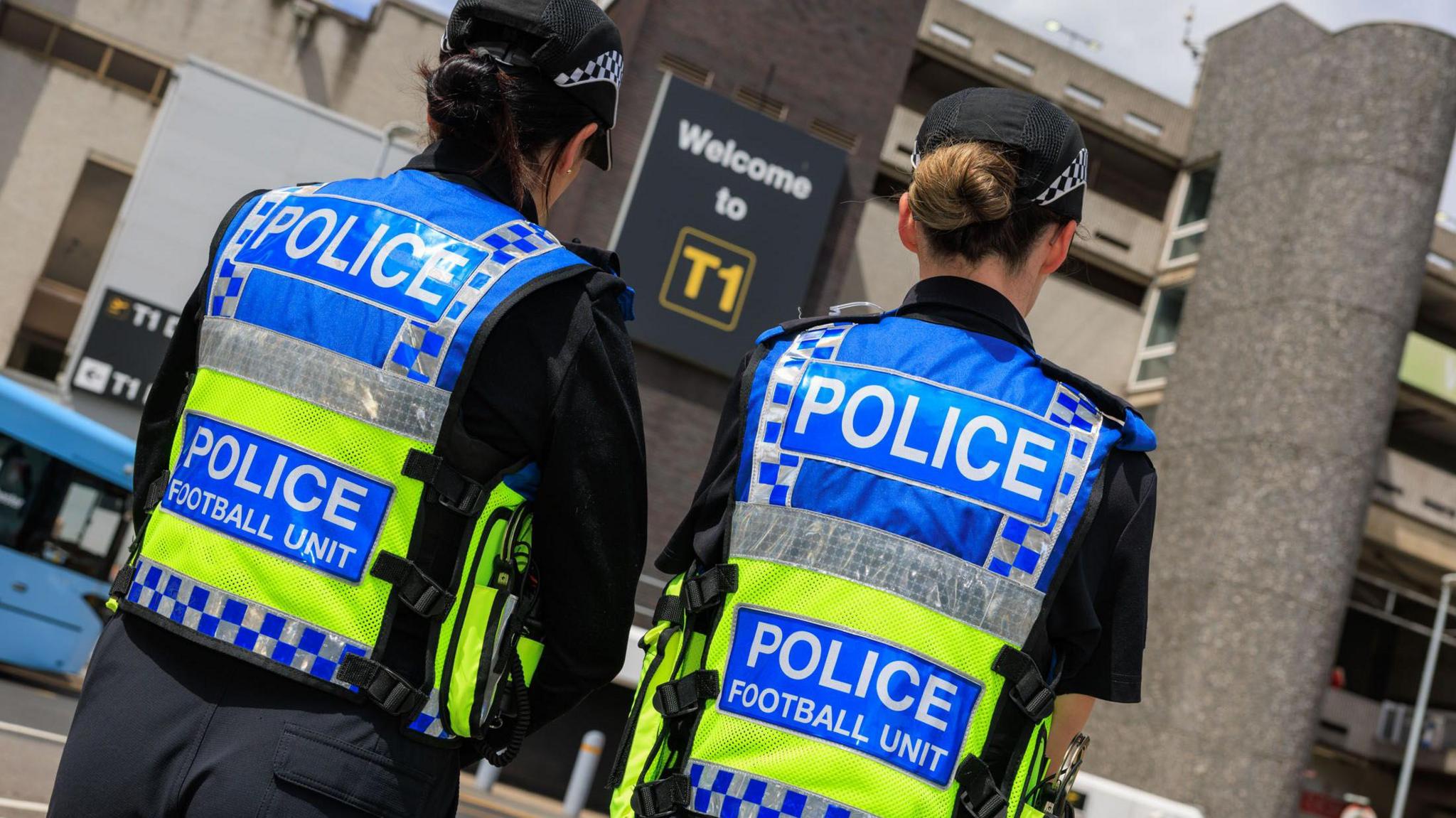 Greater Manchester Police stood outside Manchester Airport