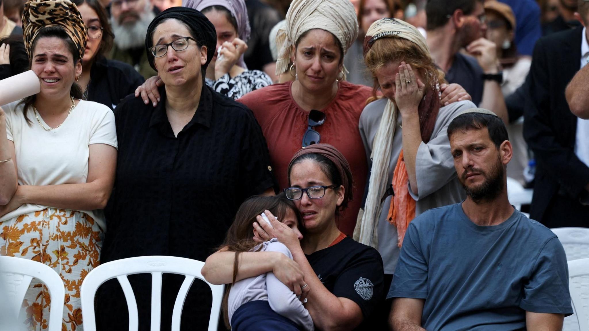 Family members and other mourners attend the funeral in Jerusalem of Israeli soldier Master Sergeant Yona Efraim Feldbaum who the Israeli military says was killed in a Hamas attack in southern Gaza (29 October 2025)