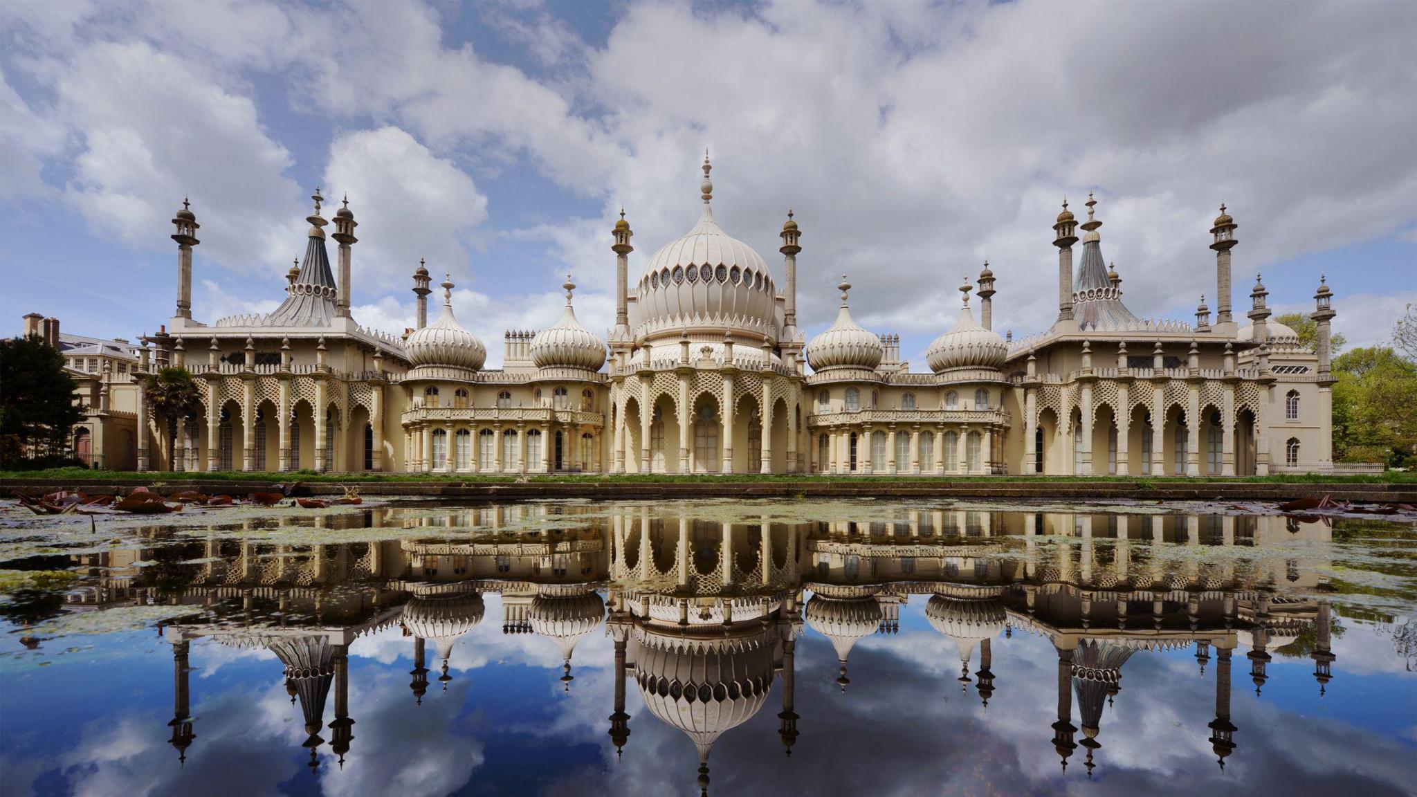 Brighton Royal Pavilion, with its numerous domes and minarets, reflected onto a lake