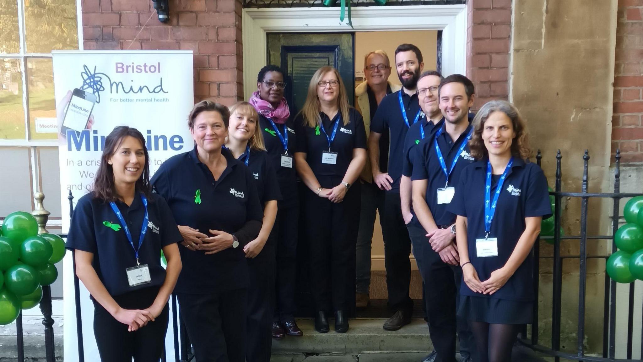 Bristol Mind team stand outside their offices 