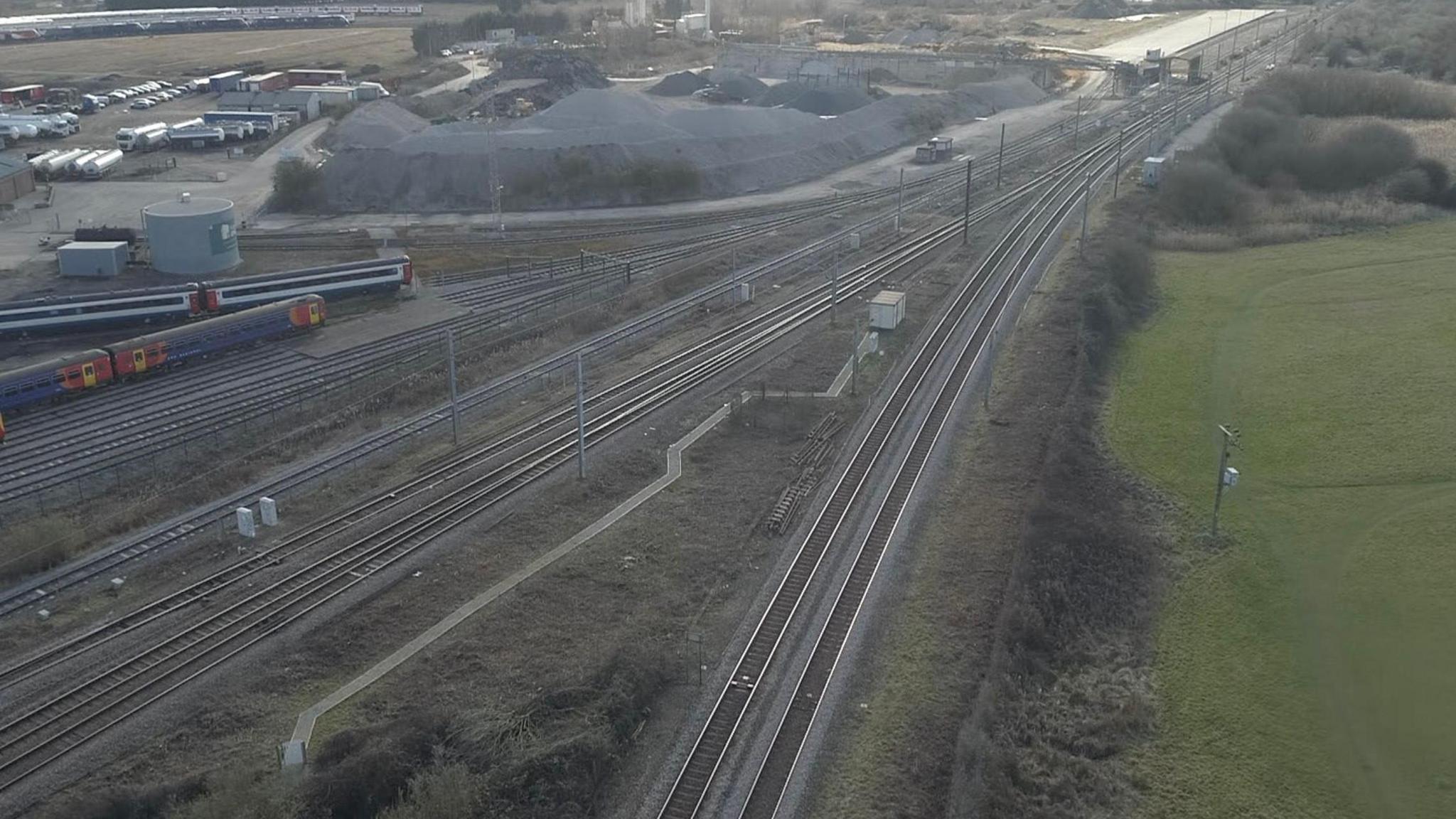 An aerial view of Ely North junction showing two rail lines converging on the junction