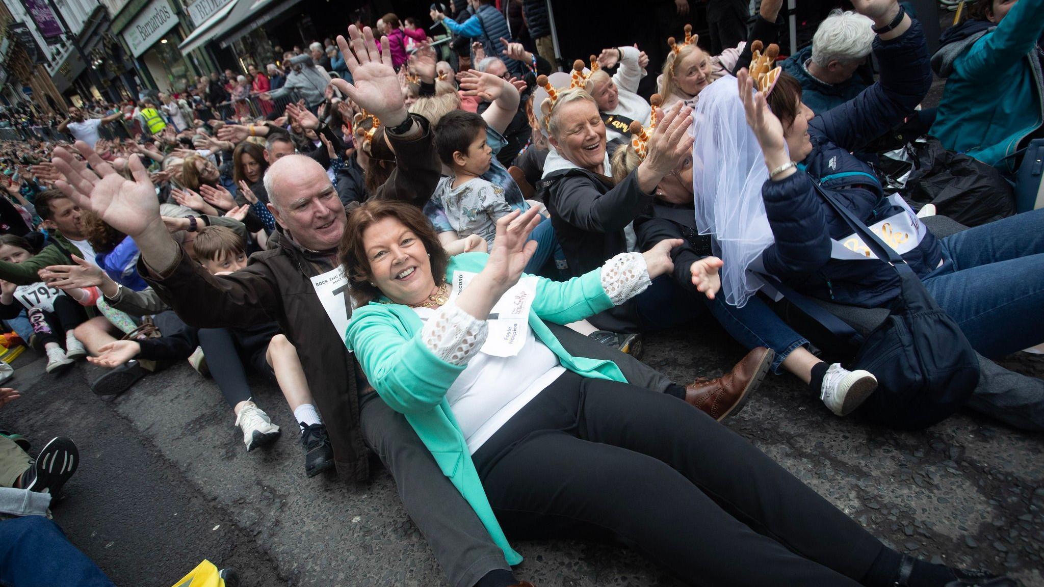 people taking part in world record rock the boat attempt in derry