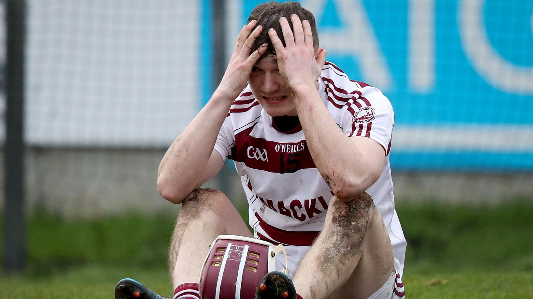 Brian Cassidy has his head in his hands after the final whistle of Slaughtneil's All-Ireland Club Hurling semi-final defeat by 13-man Na Piarsaigh