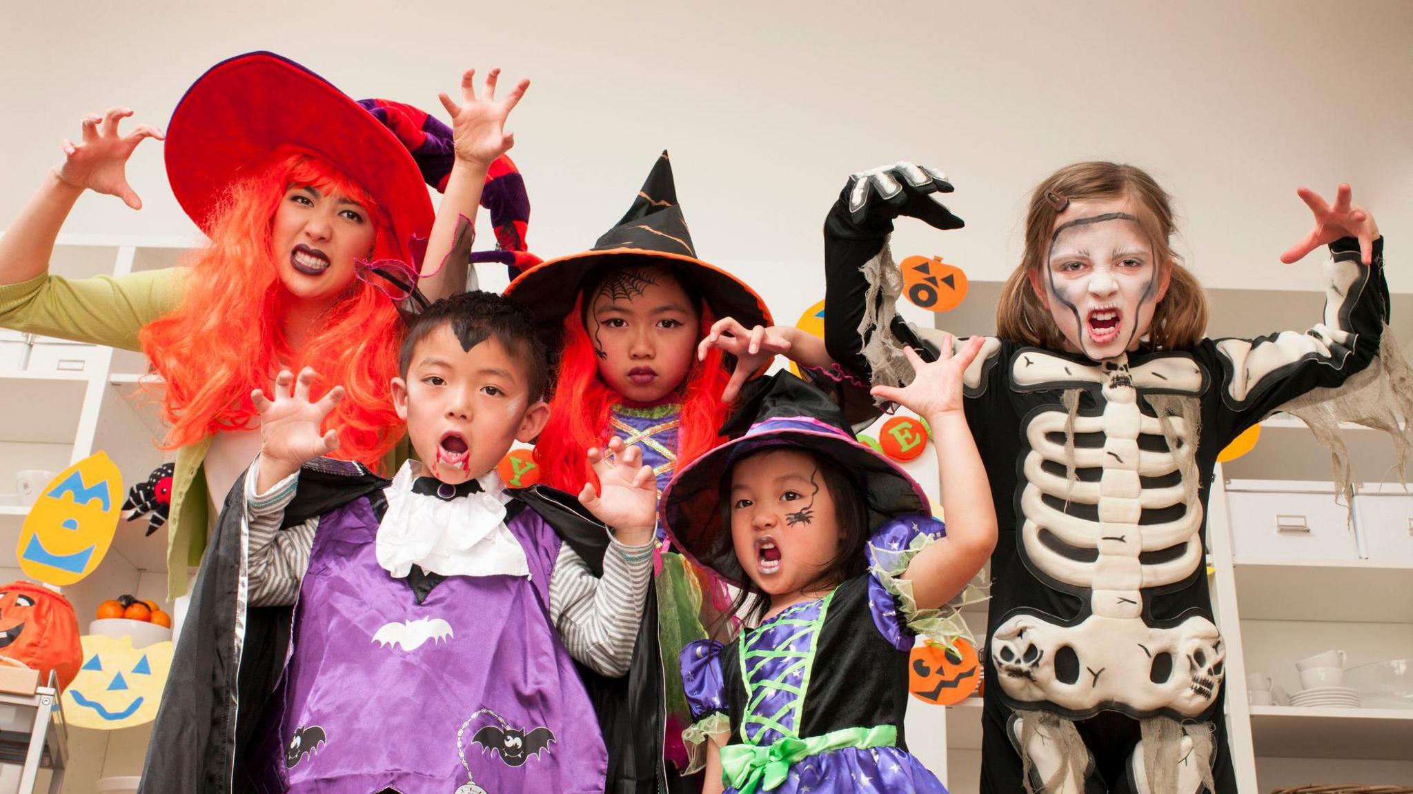 Family dressed up in scary costumes. 