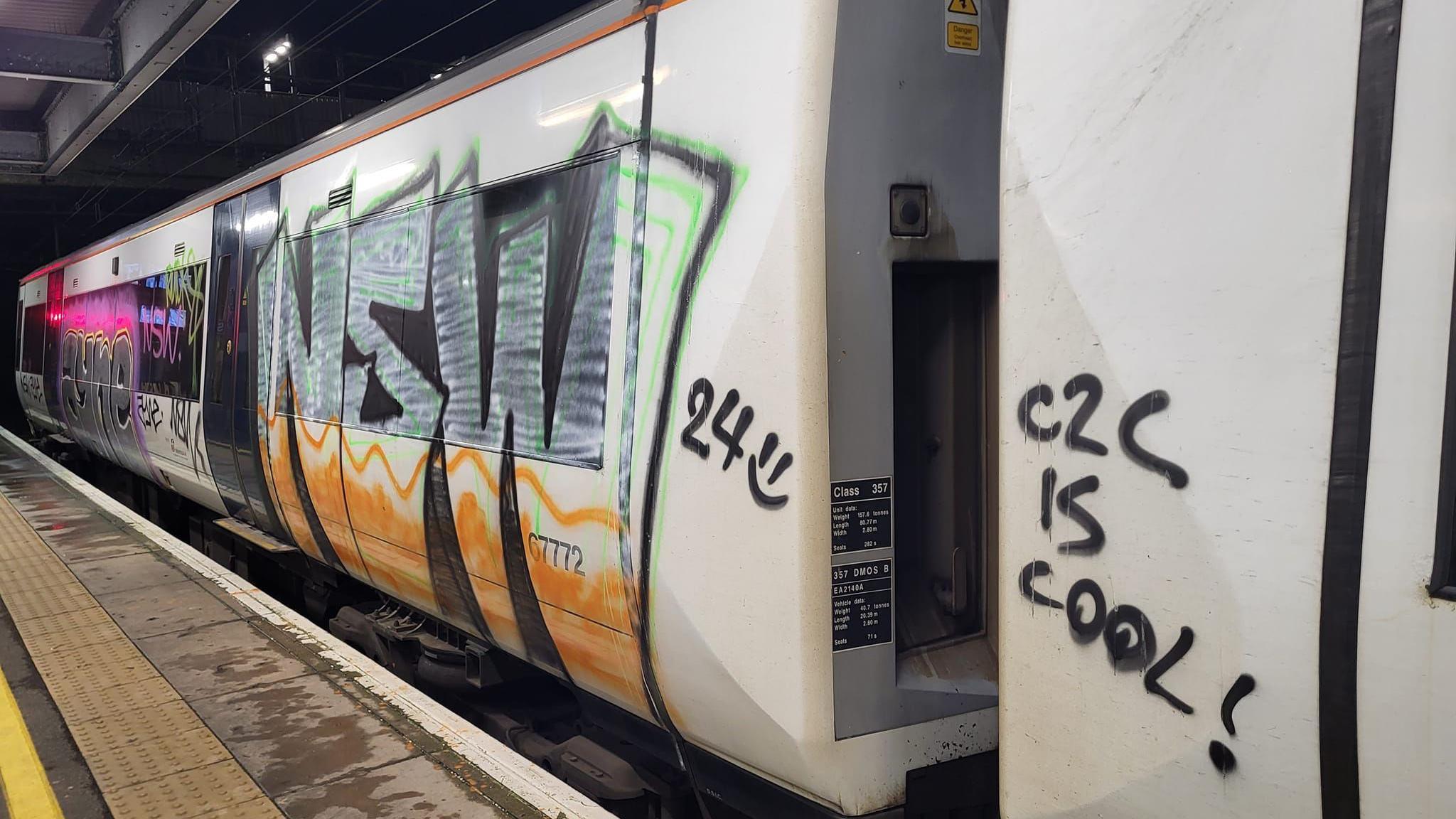 A train carriage covered in graffiti at Laindon railway station