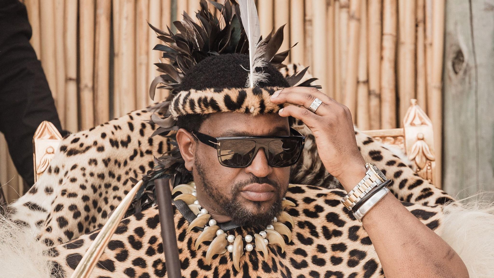 King Misuzulu kaZwelithini is pictured in sunglasses and leopard print ceremonial clothing
