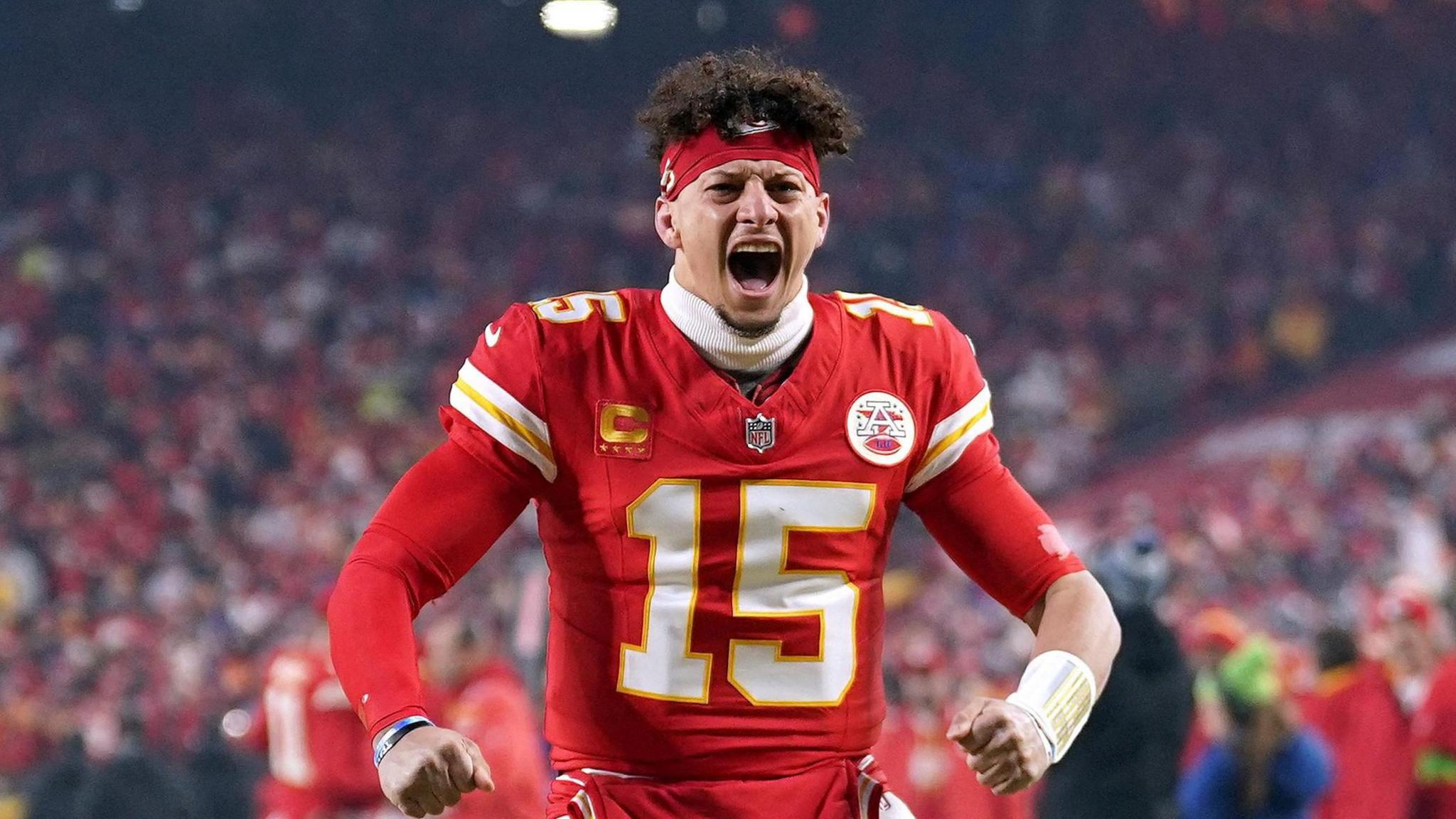 Kansas City Chiefs quarterback Patrick Mahomes pumps his arms and fires up the crowd before a game.