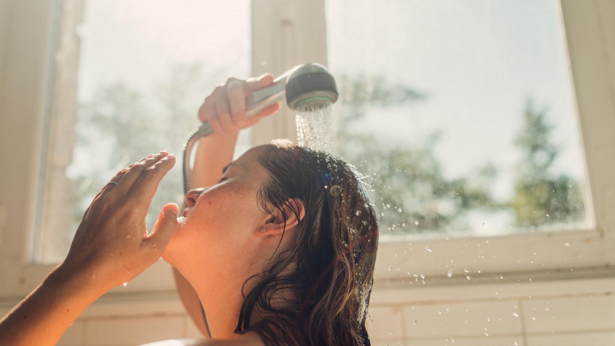 A woman showering.