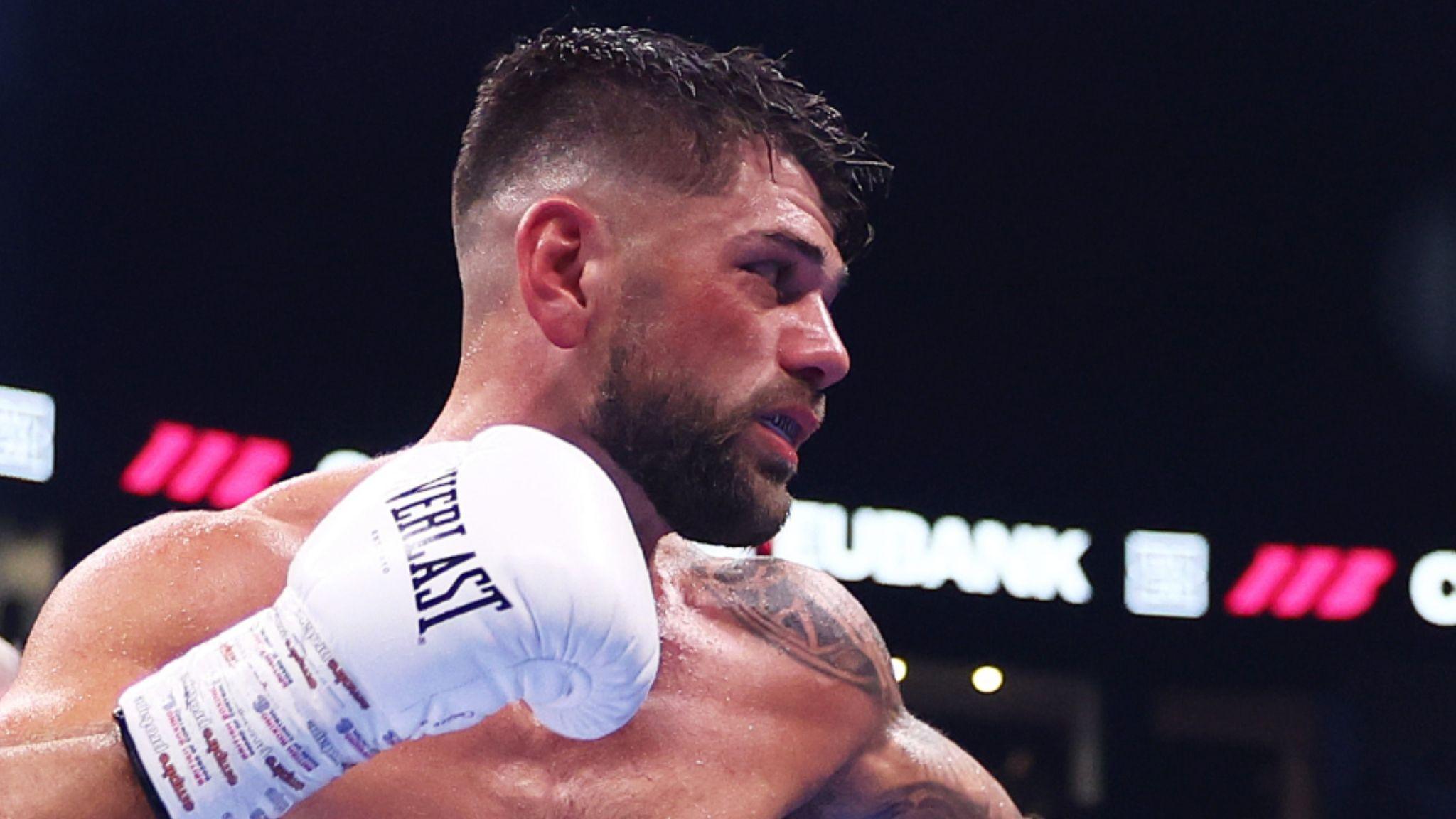 Joe Cordina side-on in the ring with gloved right fist raised