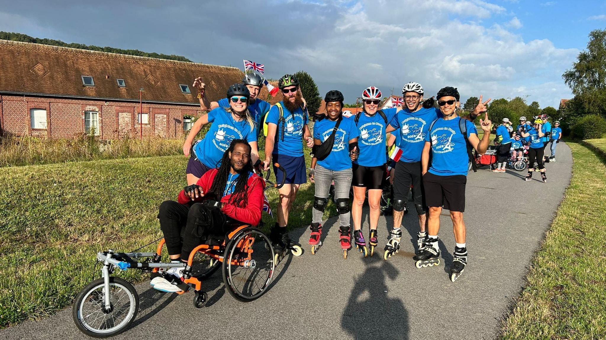 A group of skaters and wheelchair users.