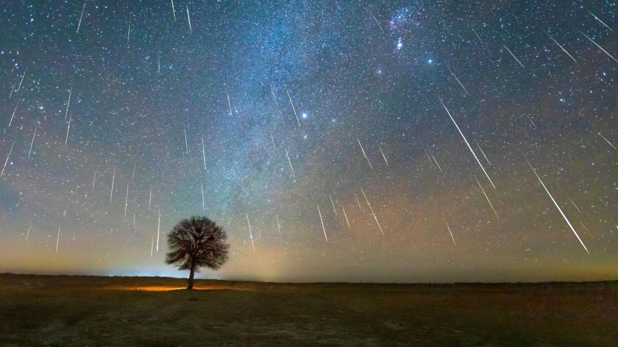 The Geminid meteor shower on December 13, 2020 was photographed in the Kubuqi Desert of Inner Mongolia, China. 