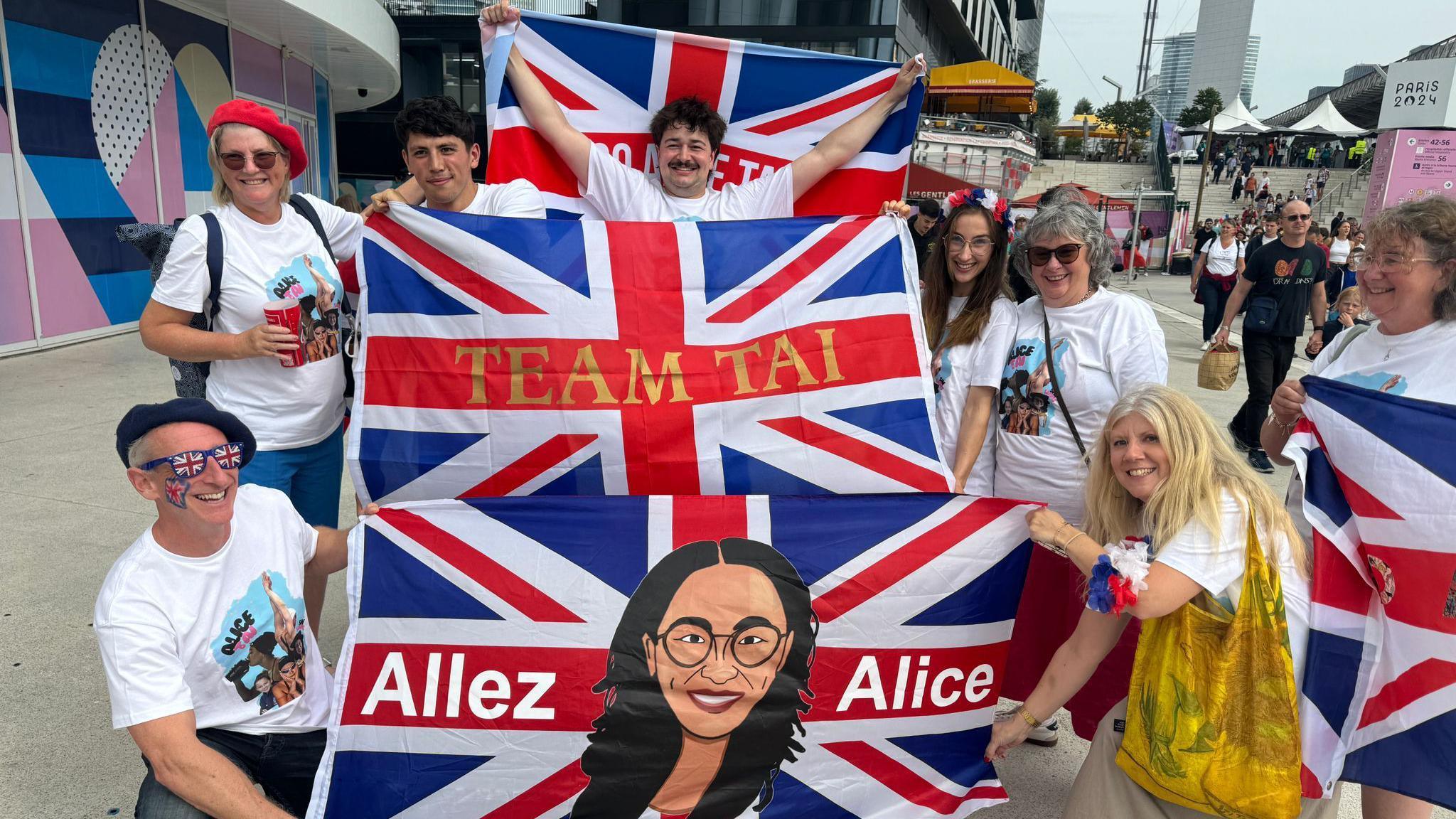 Supporters of Team GB's Alice Tai show off their flags prior to her Paralympic race. 