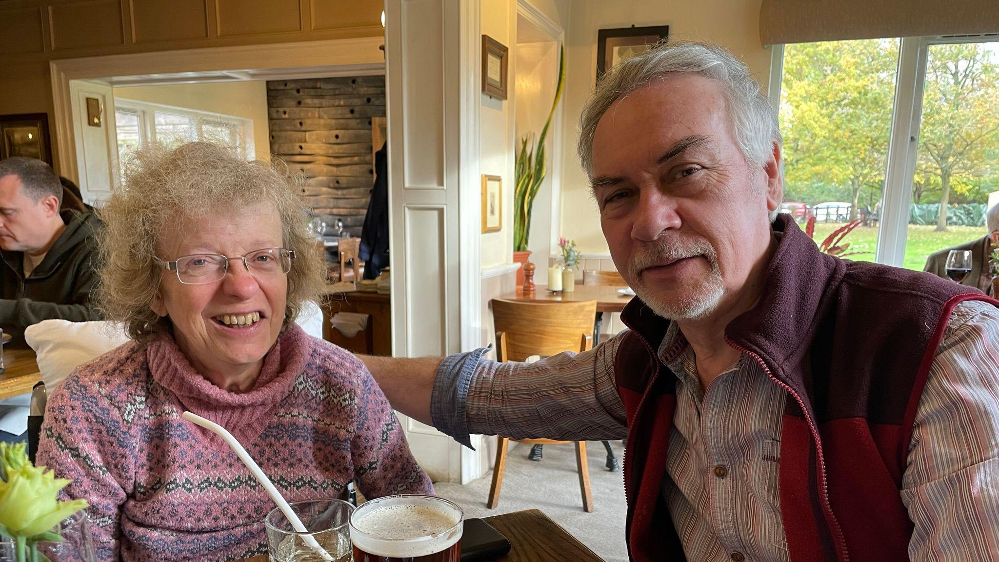 David and Alison sat together at a pub