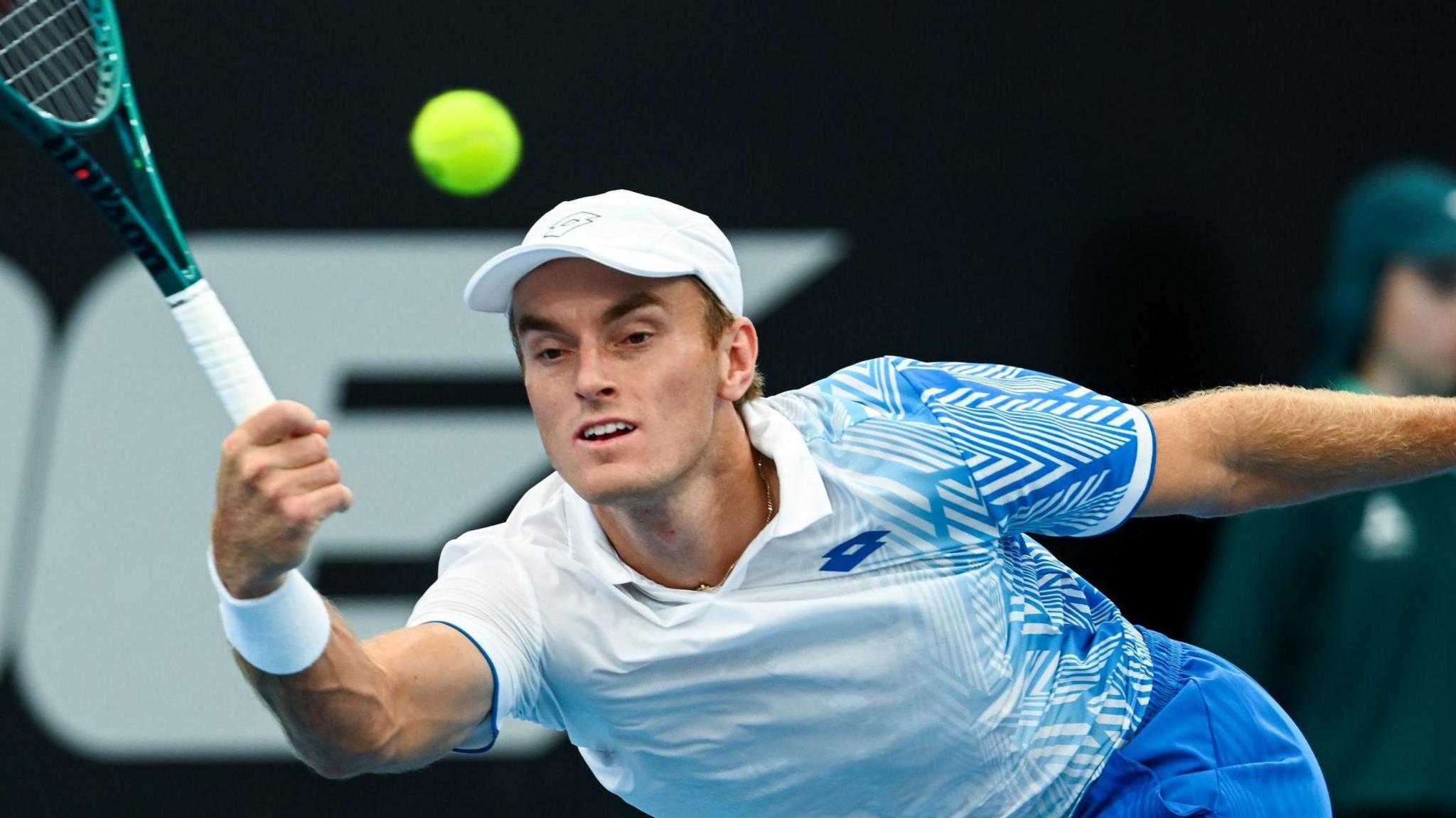 Tristan Schoolkate reaches for a forehand