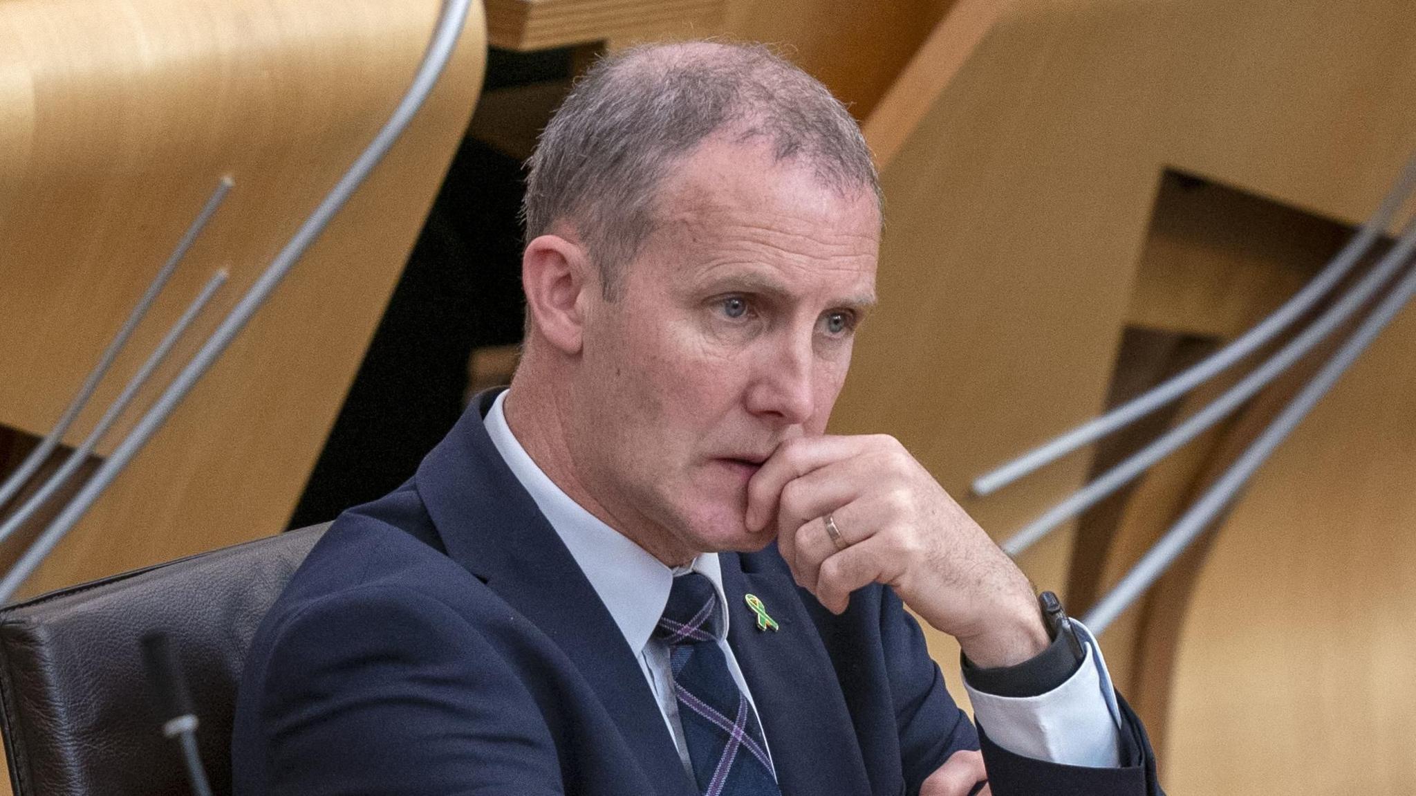 Michael Matheson sitting in the Holyrood chamber 