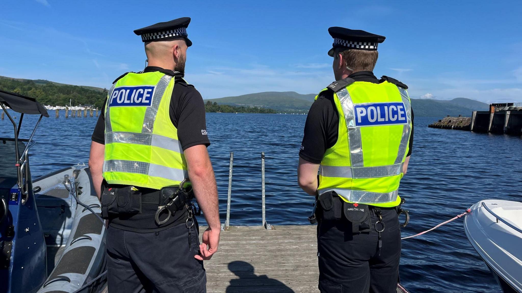Two police officers on the banks of Loch Lomond