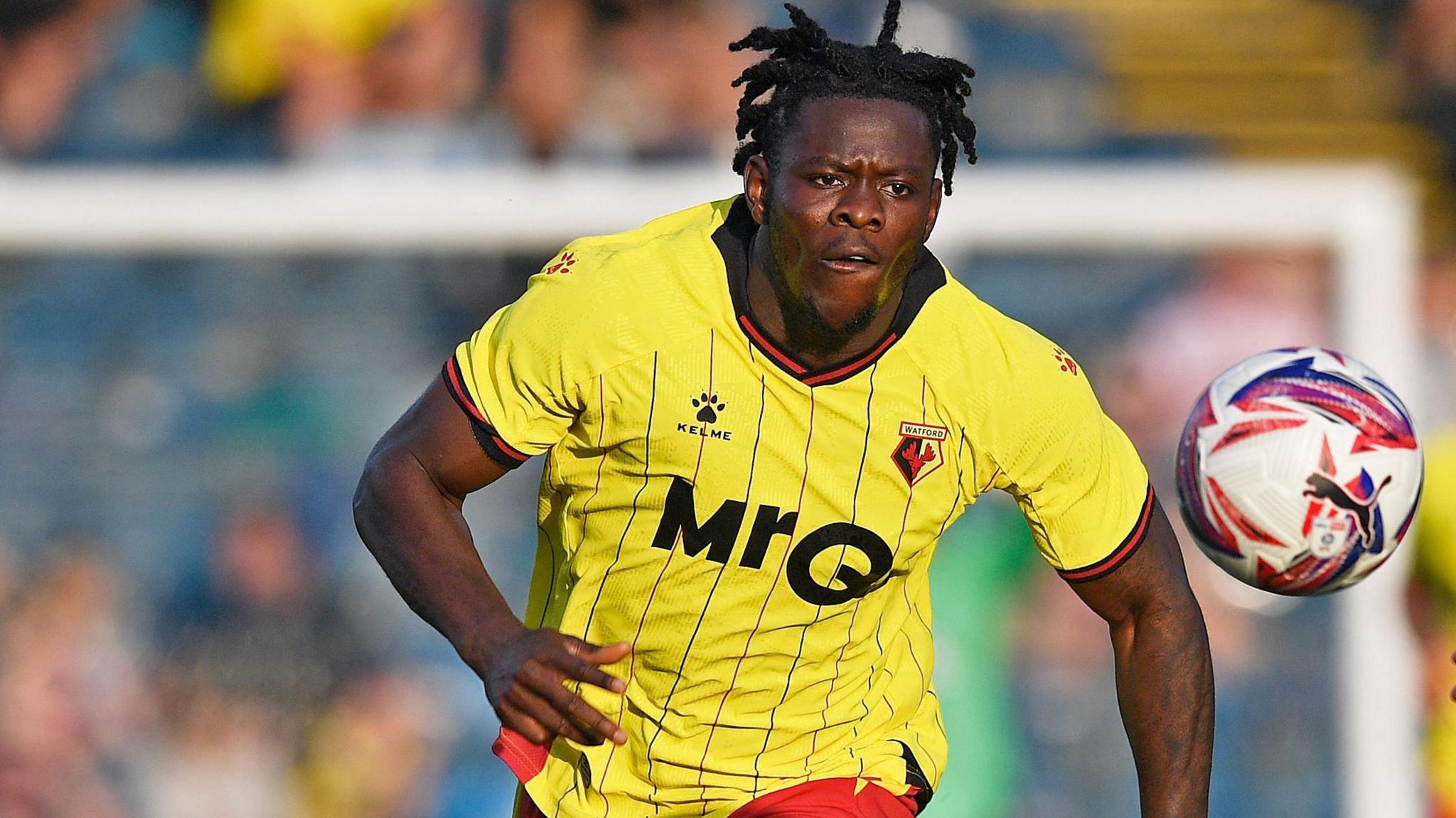 Kwadwo Baah chases the ball during a game for Watford