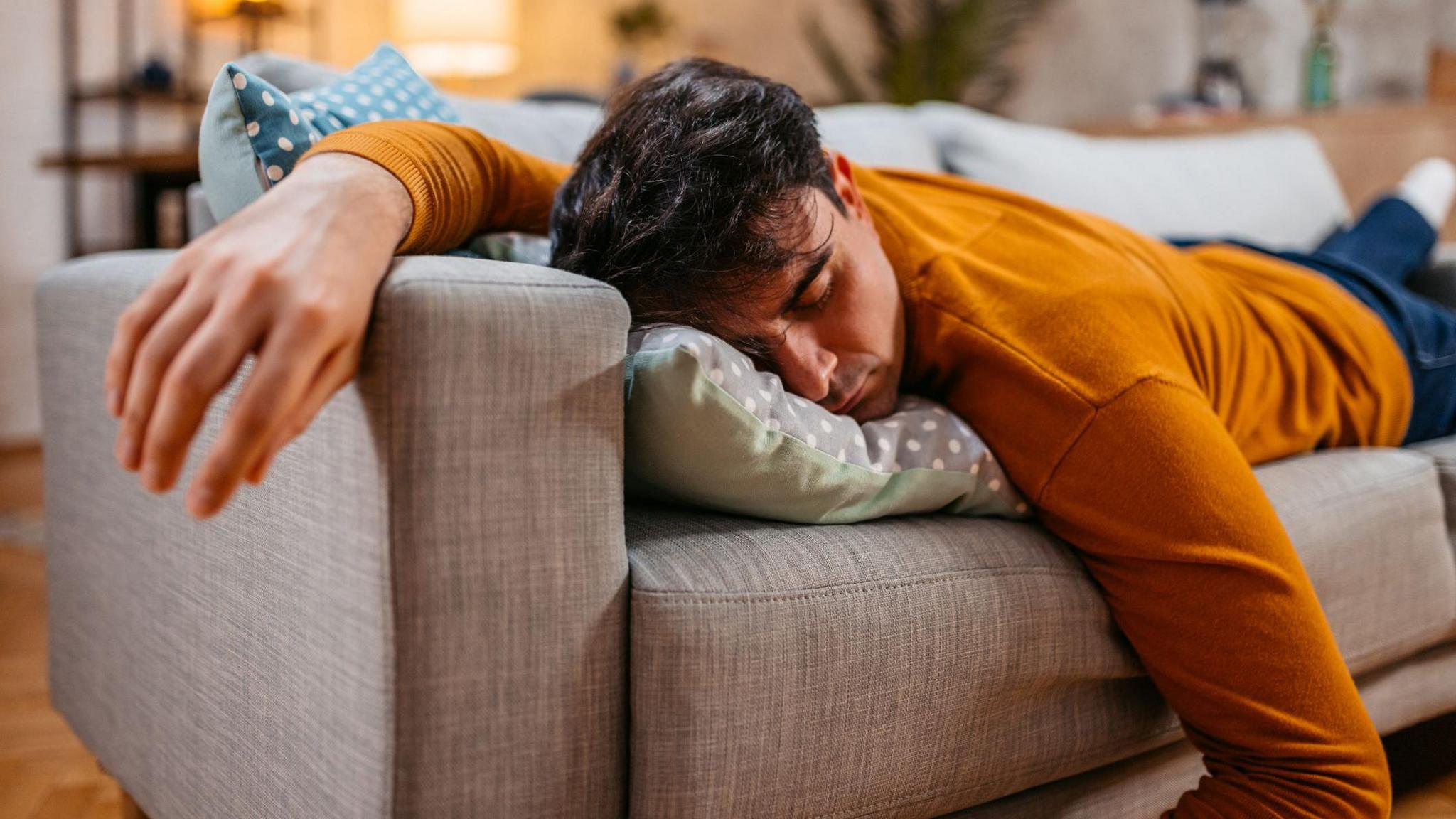 A man asleep on the sofa