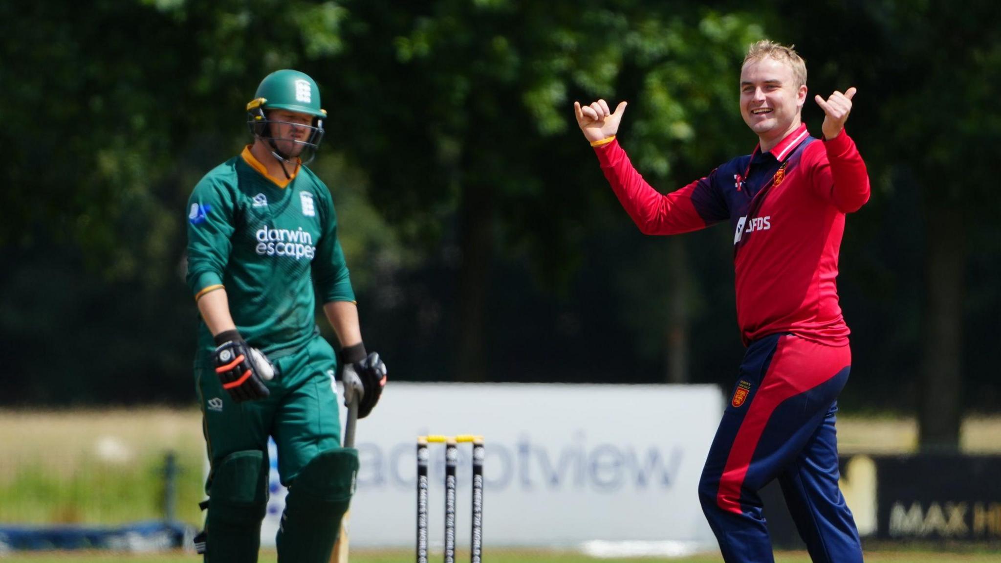 Jersey bowler Dom Blampied celebrates taking a Guernsey wicket