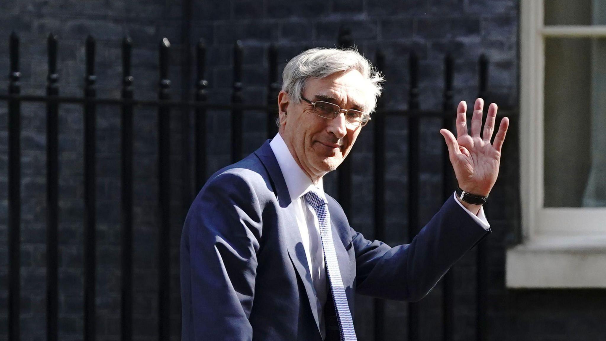 Sir John Redwood MP waving outside number 10 downing street