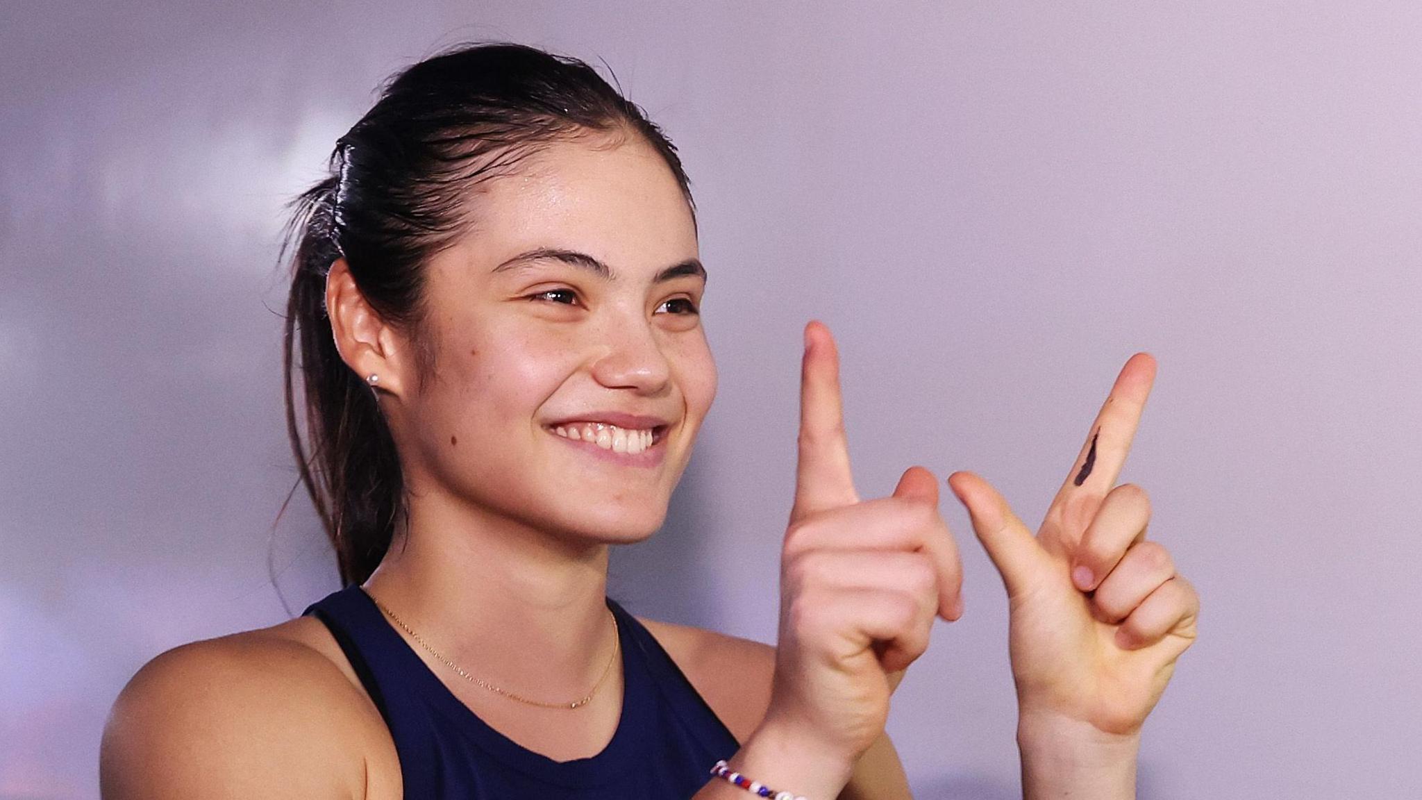 Emma Raducanu celebrates winning her match at the 2024 Billie Jean King Cup