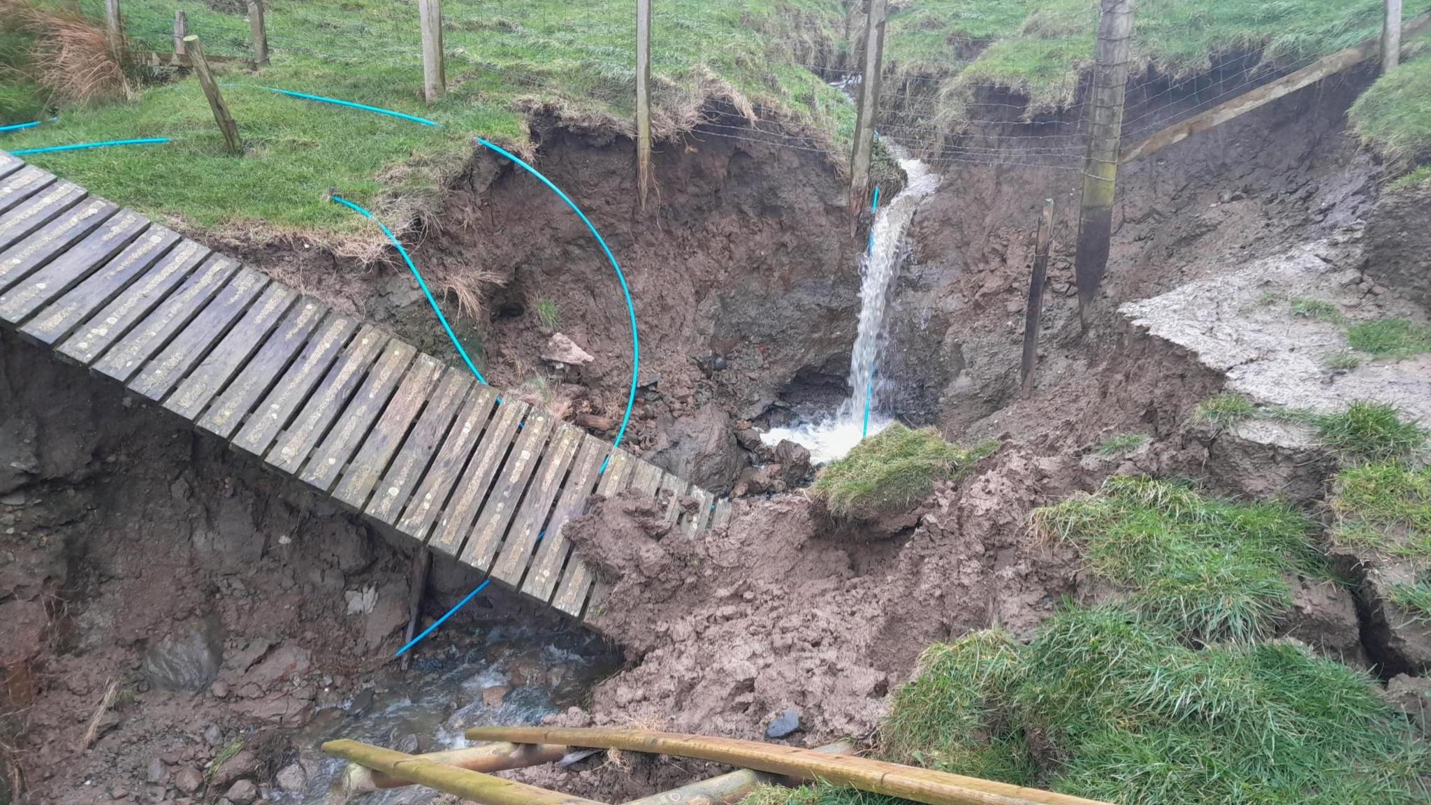 Wales Coast Path section collapses as sinkhole swallows walkway - BBC News