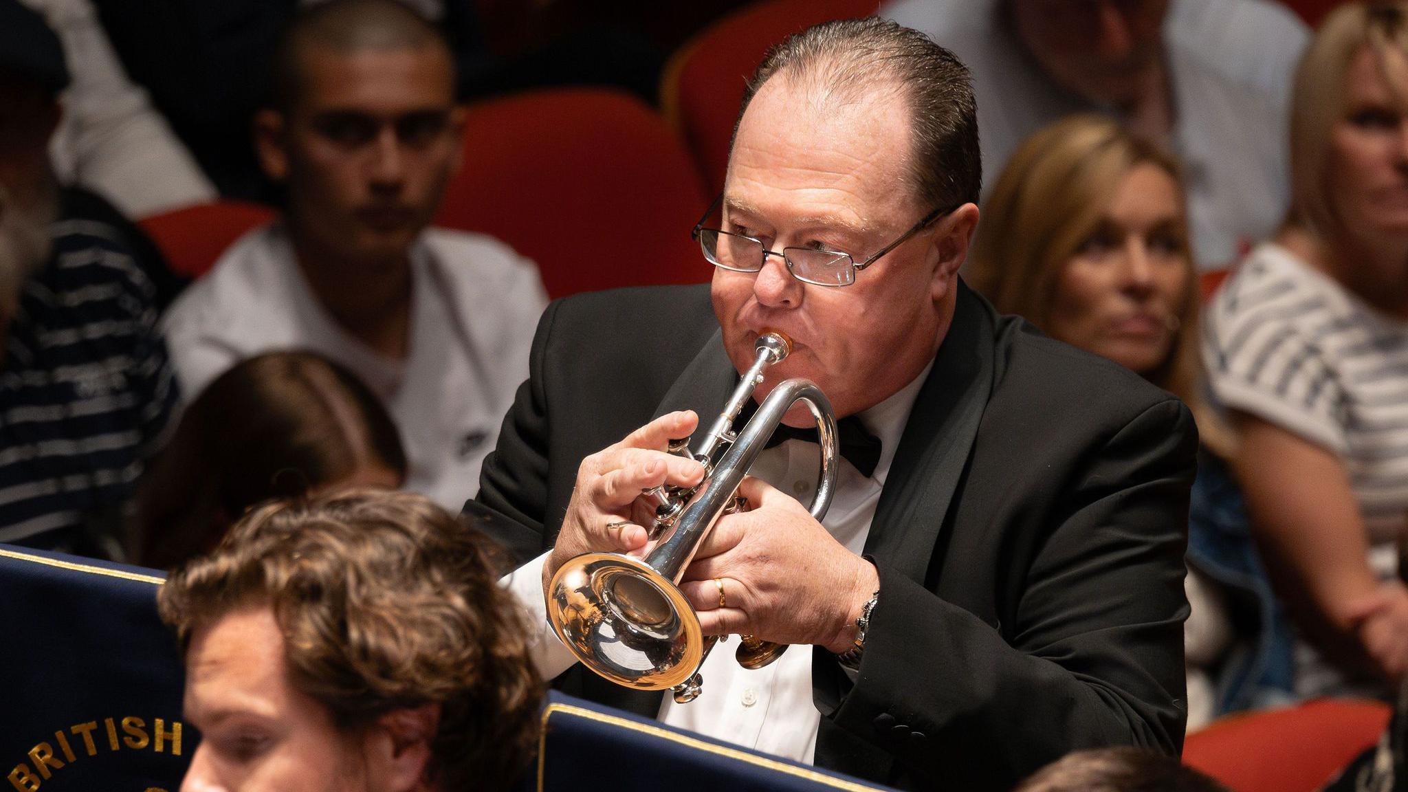 Close-up of Paul Richards playing the cornet in the band