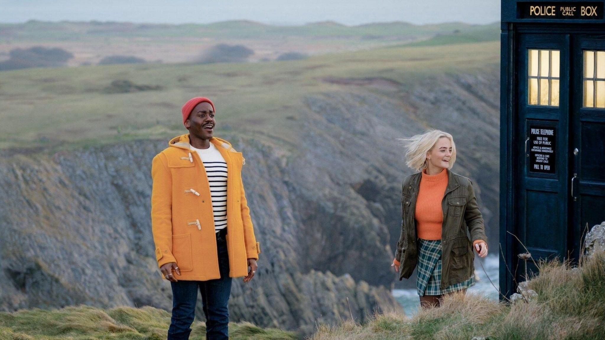 The Doctor and Ruby materialise on a rocky outcrop in Tenby.