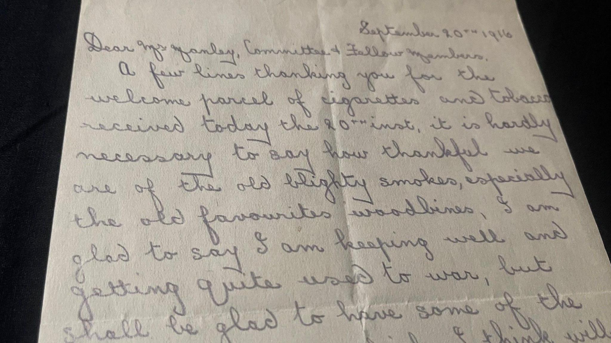 A handwritten letter in pencil with neat cursive handwriting