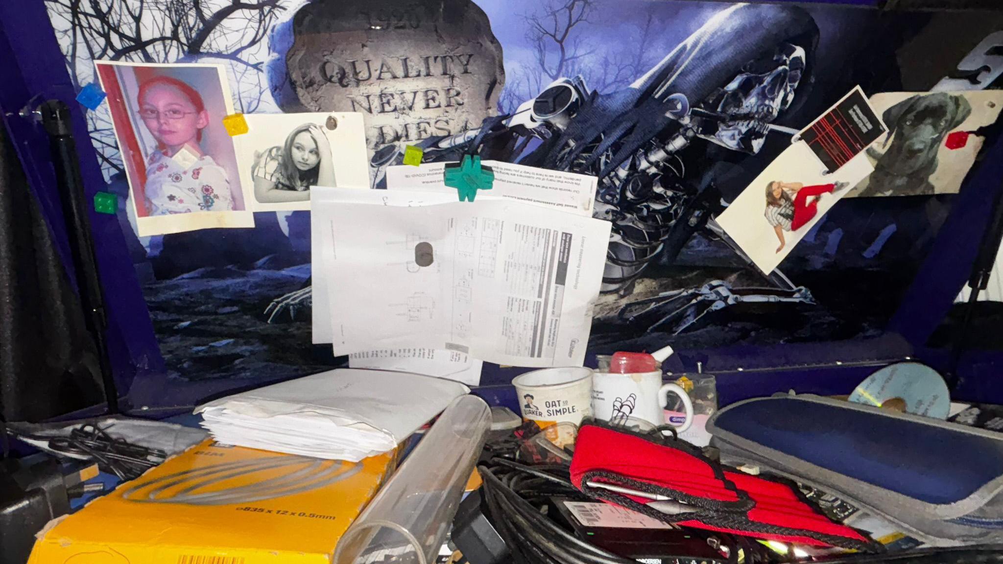 The contents of Warren's toolbox. Alongside various tools, several pictures of Molly as a child are stuck to the lid along with a picture of a black labrador