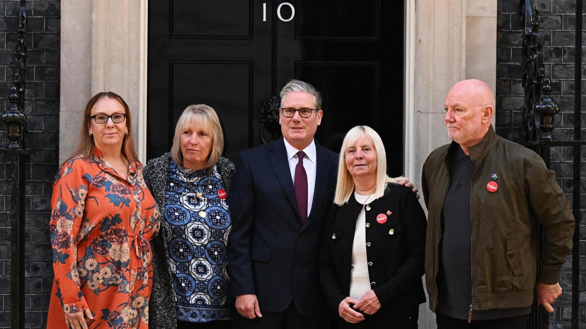 Sir Keir Starmer greets Charlotte Hennessy, Sue Roberts, Margaret Aspinall (second right) and Steve Kelly, ahead of a meeting with family members of the victims of the Hillsborough disaster, outside 10 Downing Street