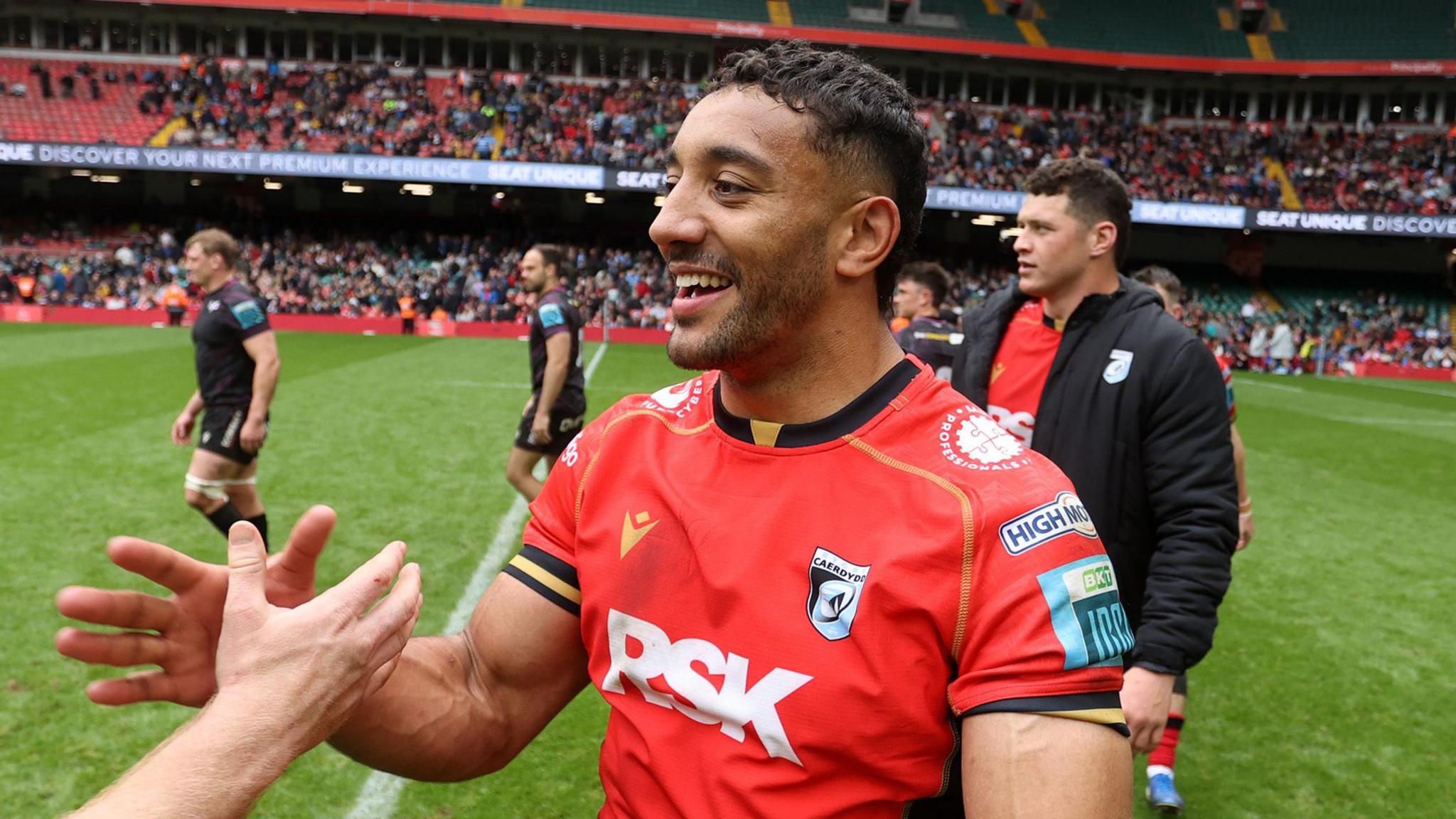 Gabriel Hamer-Webb high fives a team mate at the Principality Stadium