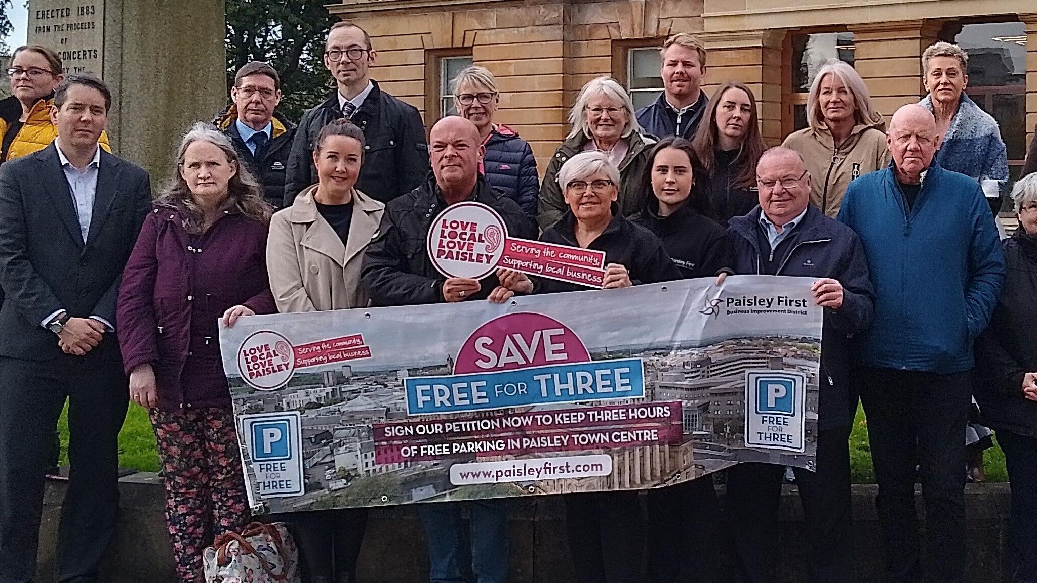 Business owners in Paisley outside the town hall