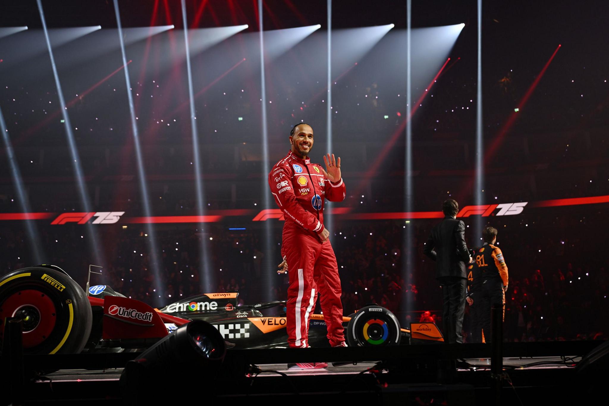 New Ferrari driver Lewis Hamilton waves to the crowd at the F1 75 launch event at the O2 Arena