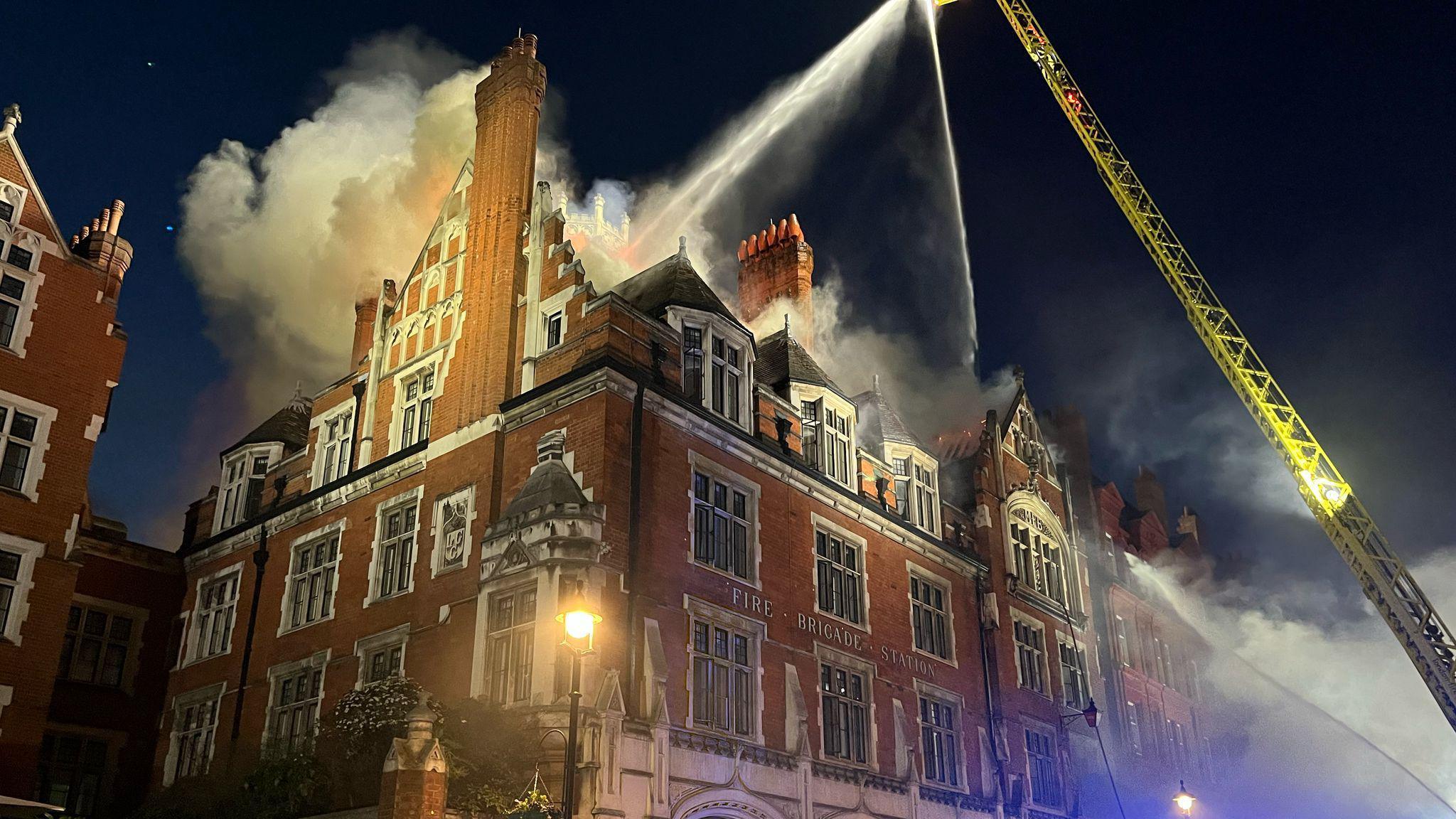 Flames and smoke come out of the roof of Chiltern Firehouse