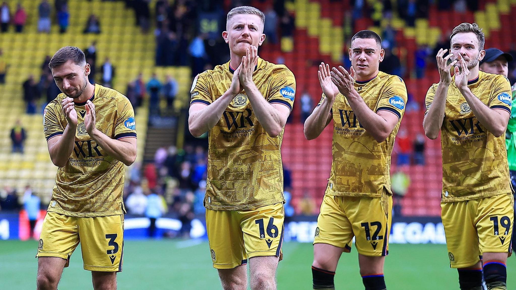 Scott Wharton leads the celebrations for Blackburn at Vicarage Road 