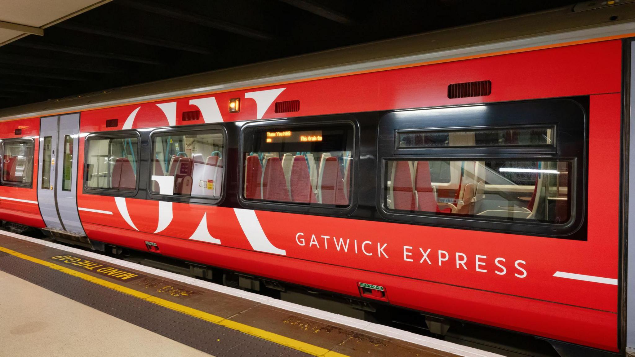 A red Gatwick Express Train at Victoria Station in London