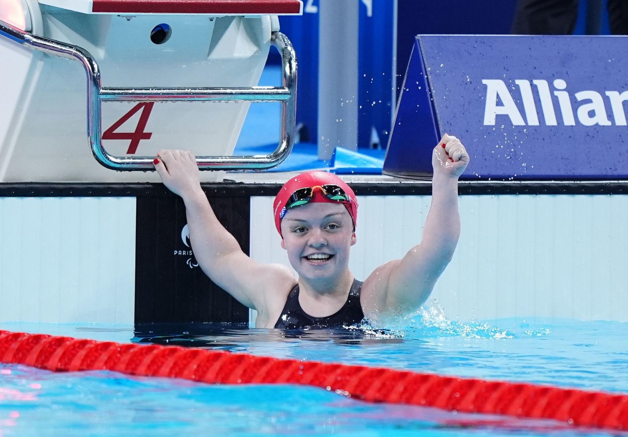 Maisie Summers-Newton reacts after winning the Women's 100m Breaststroke in the pool