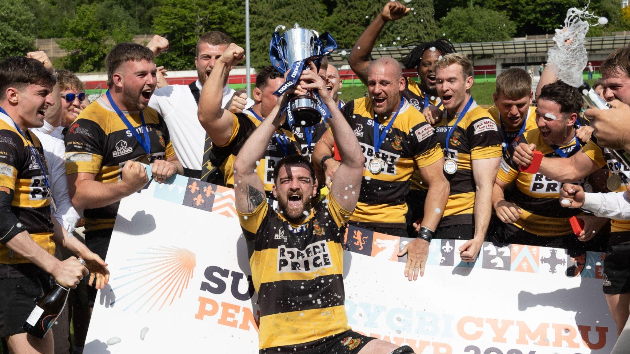 Newport players celebrate with the Super Rygbi Cymru trophy in 2025