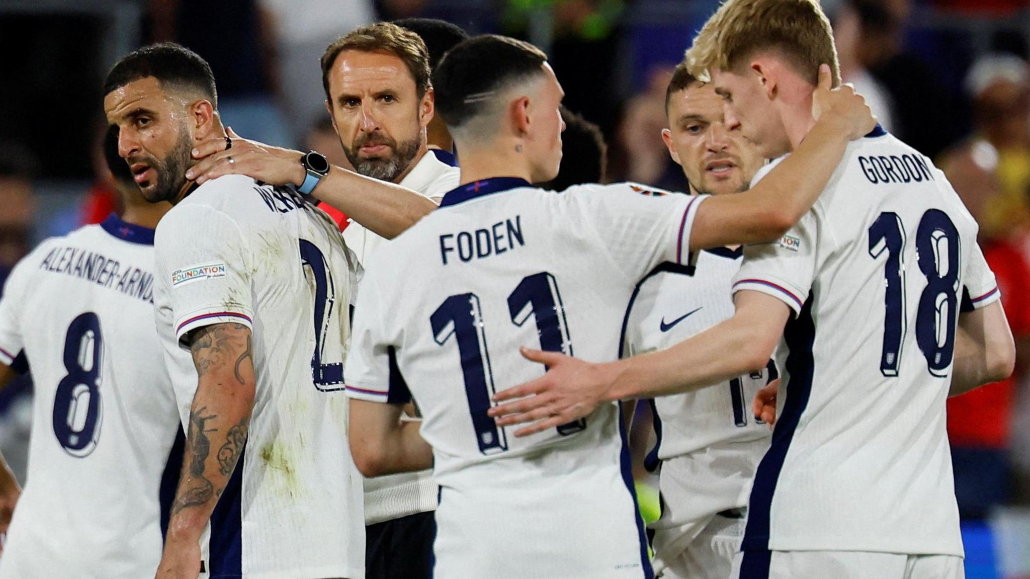 Gareth Southgate with Kyle Walker, Phil Foden and Anthony Gordon