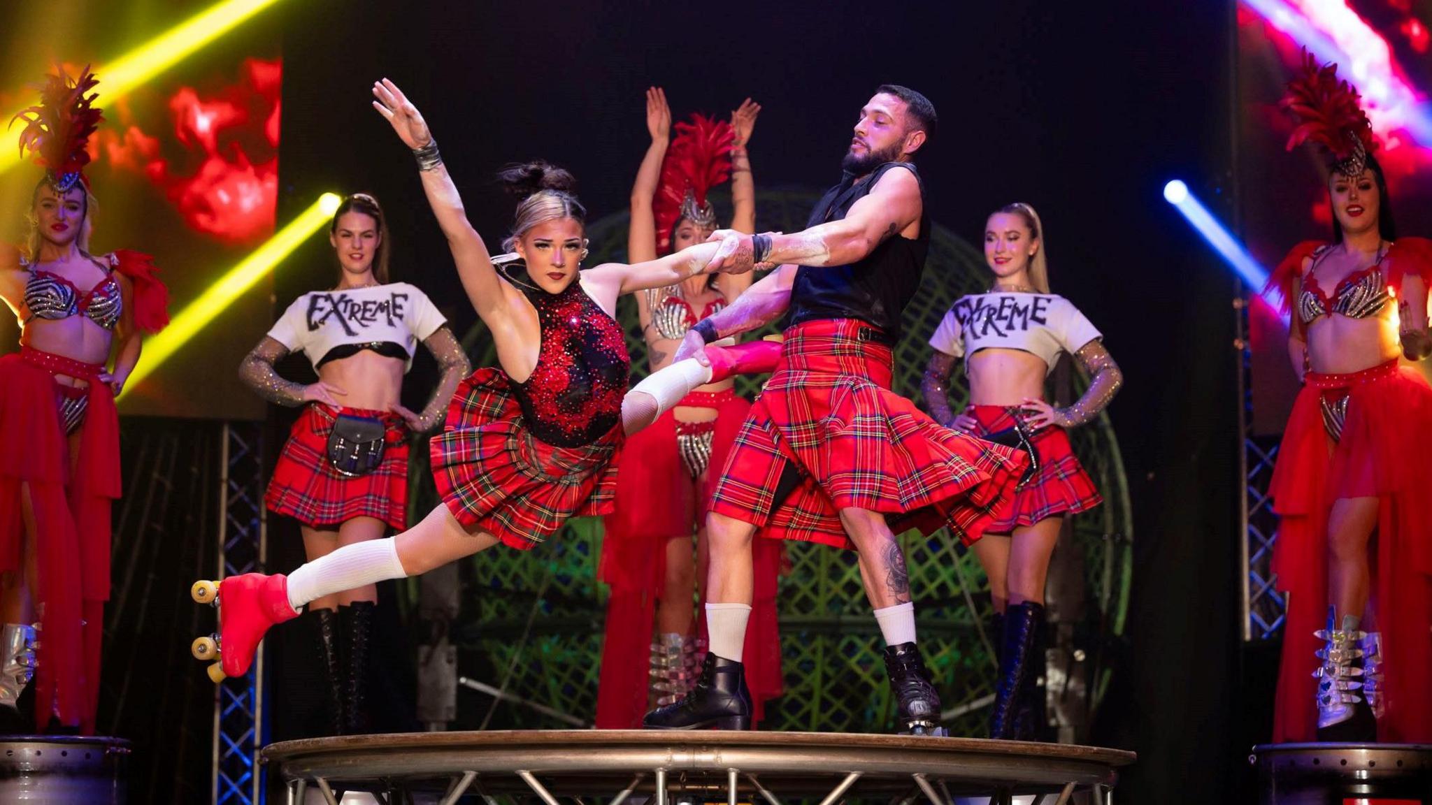 Maddie and Jamil performing high speed roller skating in the Extreme Circus touring show