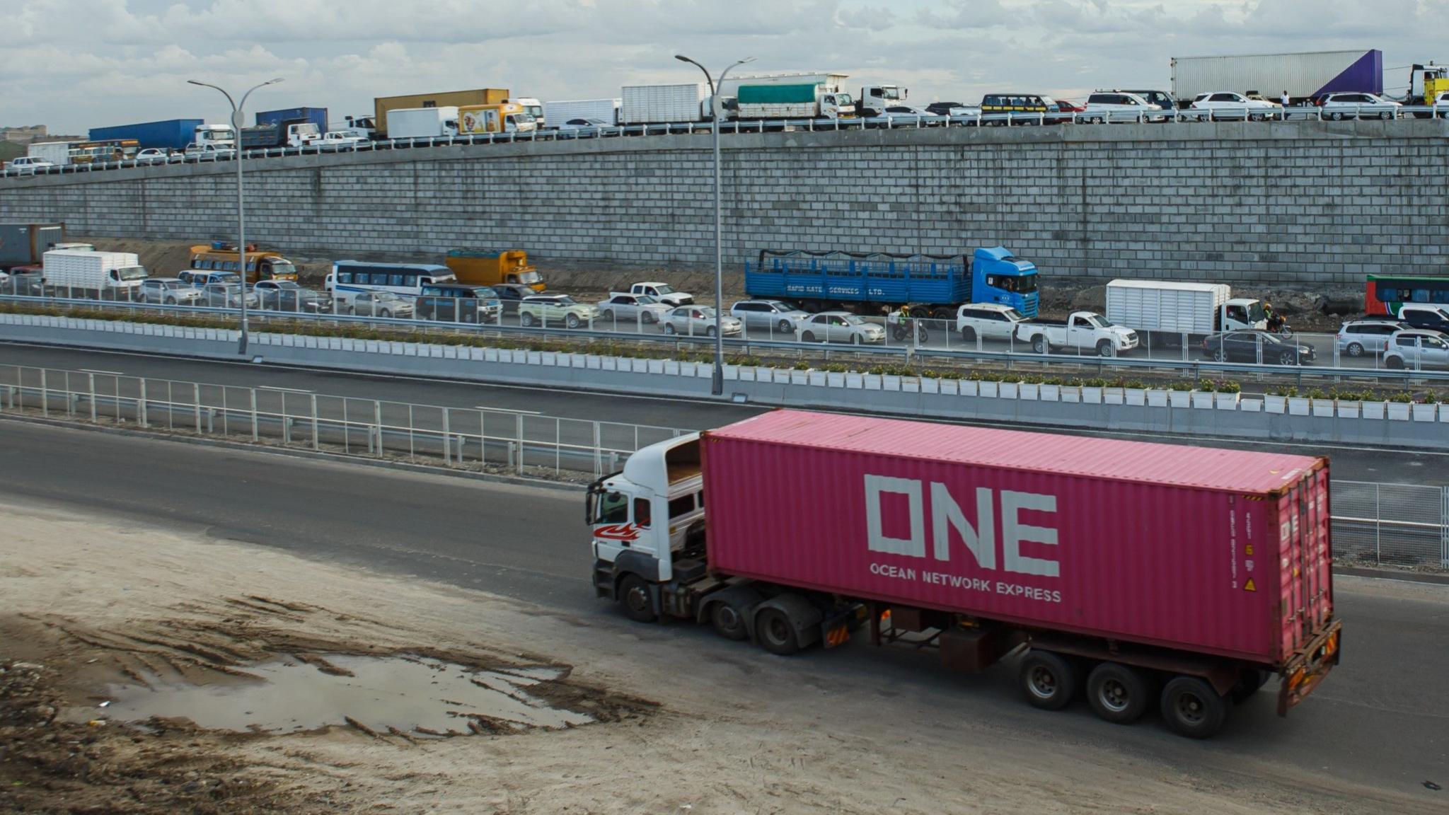 A big red truck on the Nairobi Expressway along the Mombasa road