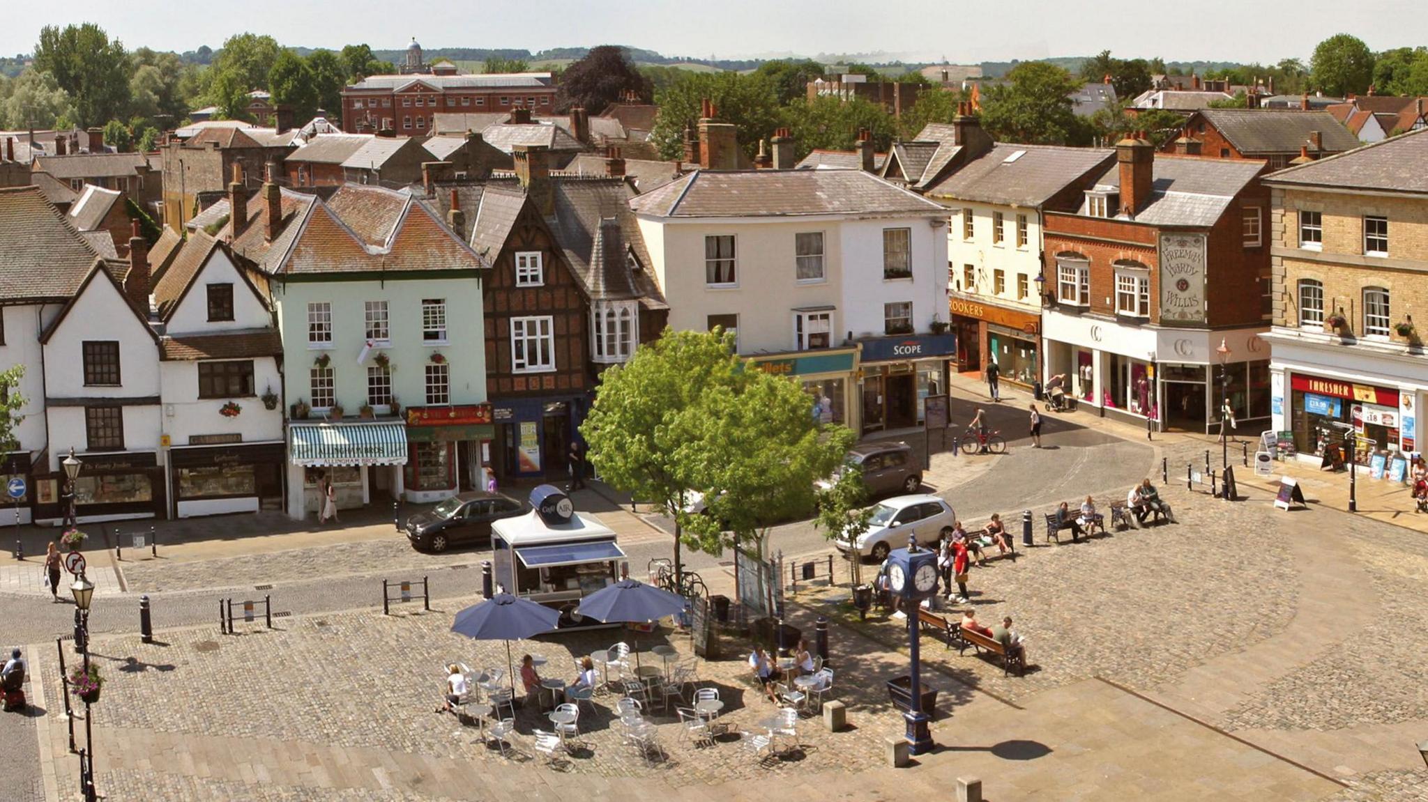 Aerial shot of Hitchin town centre showing historic shop fronts and a town square